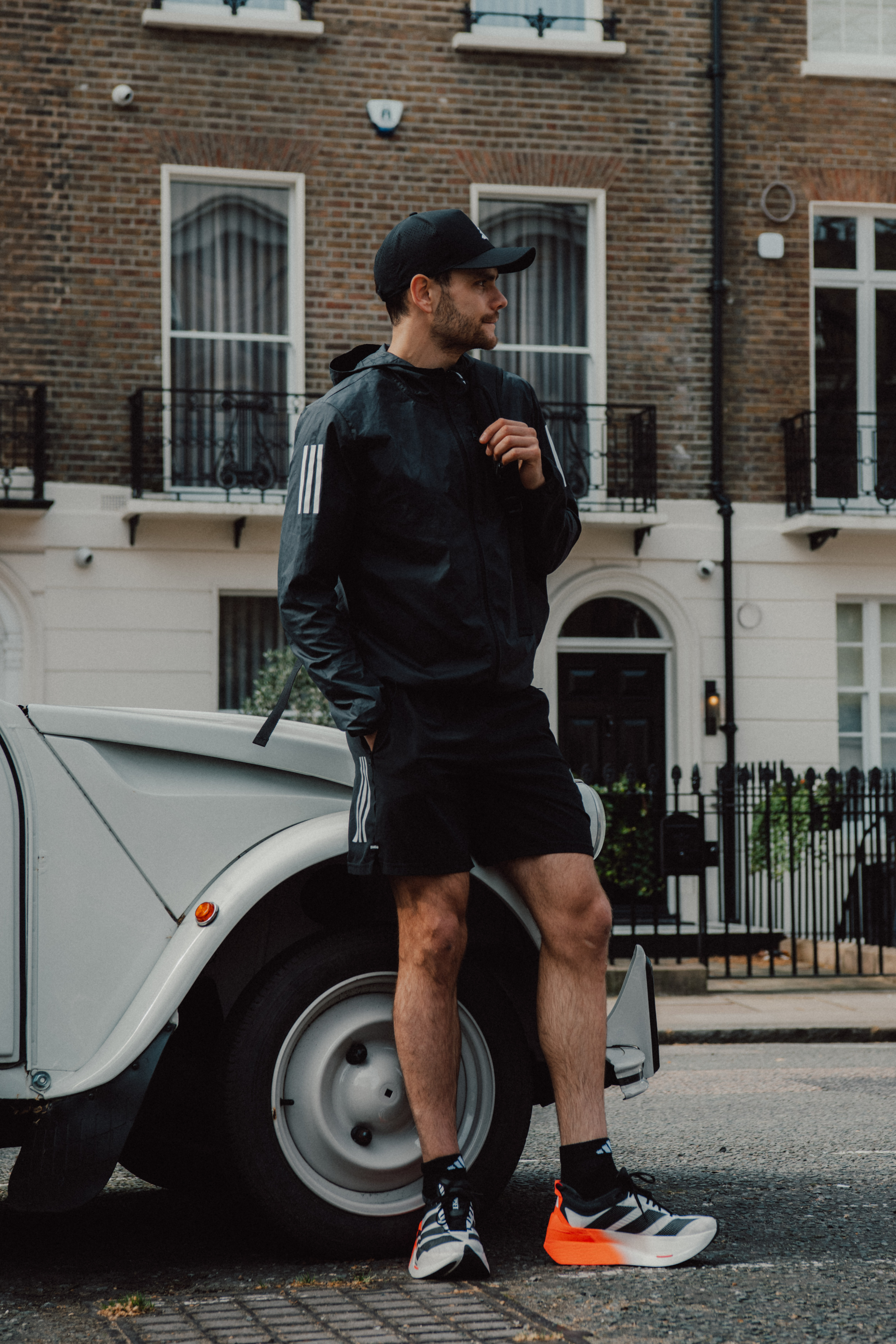 a woman sitting on a chair with a hair dryer