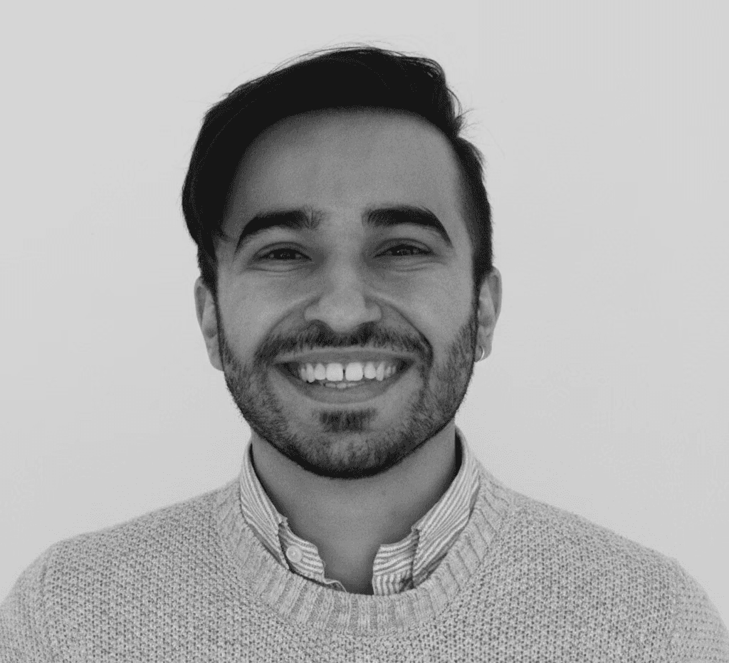 A young woman poses for a black and white photo.