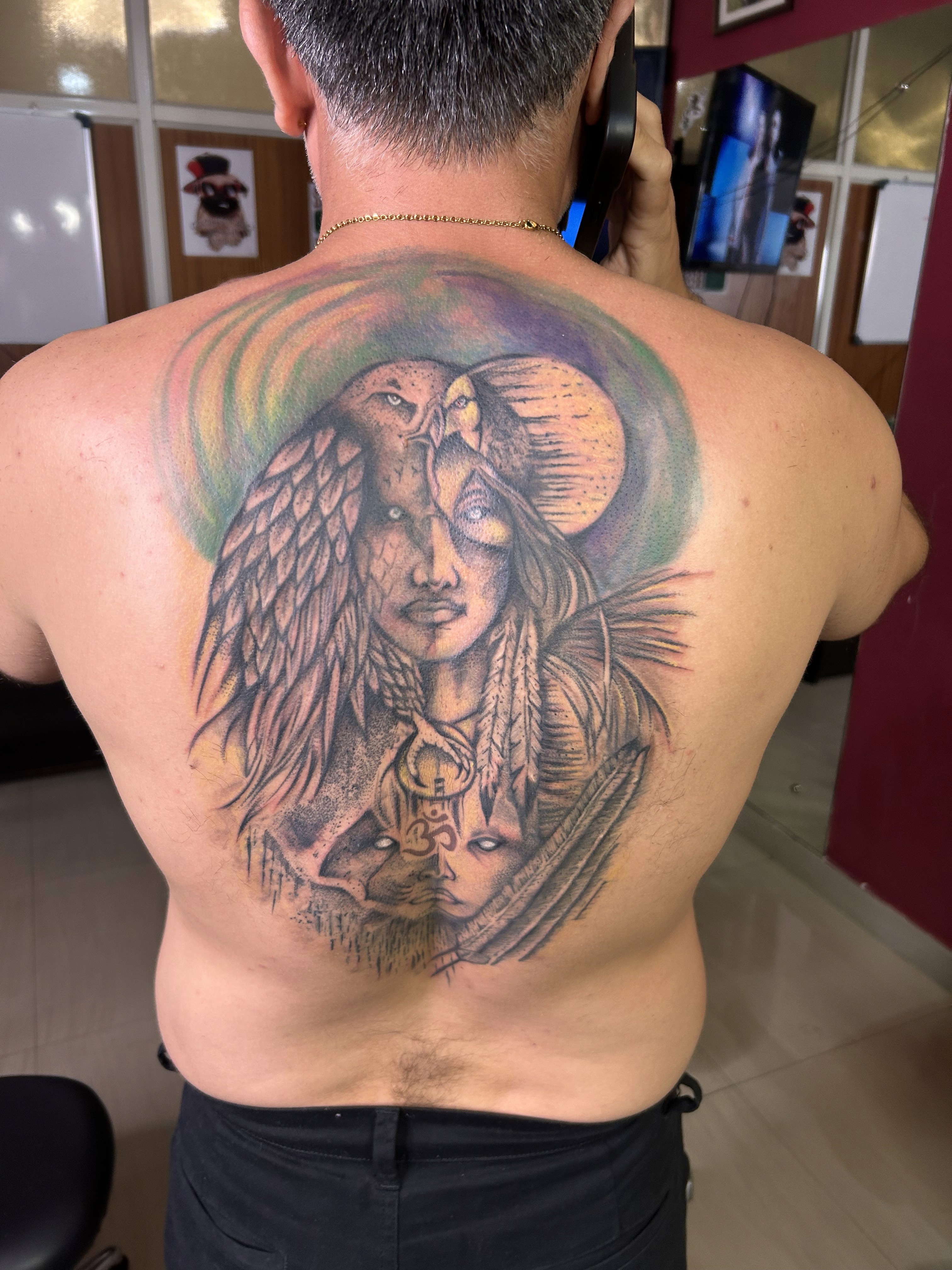 Large scale, colour ink custom back tattoo with detailed shading and symbolism, completed at Fred’s Tattoo Studio, one of the best tattoo places in Bangalore.