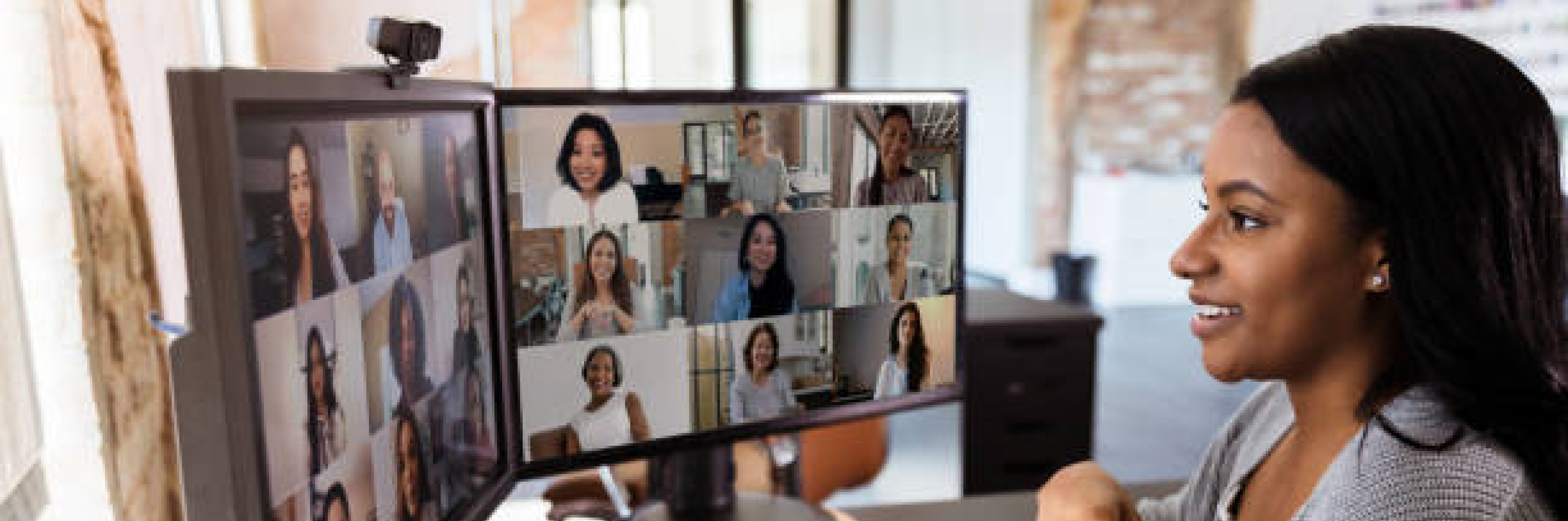 A lady speaking to other members of a virtual meeting