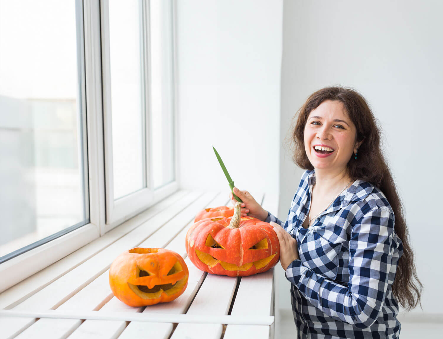 Woman carving pumpkins