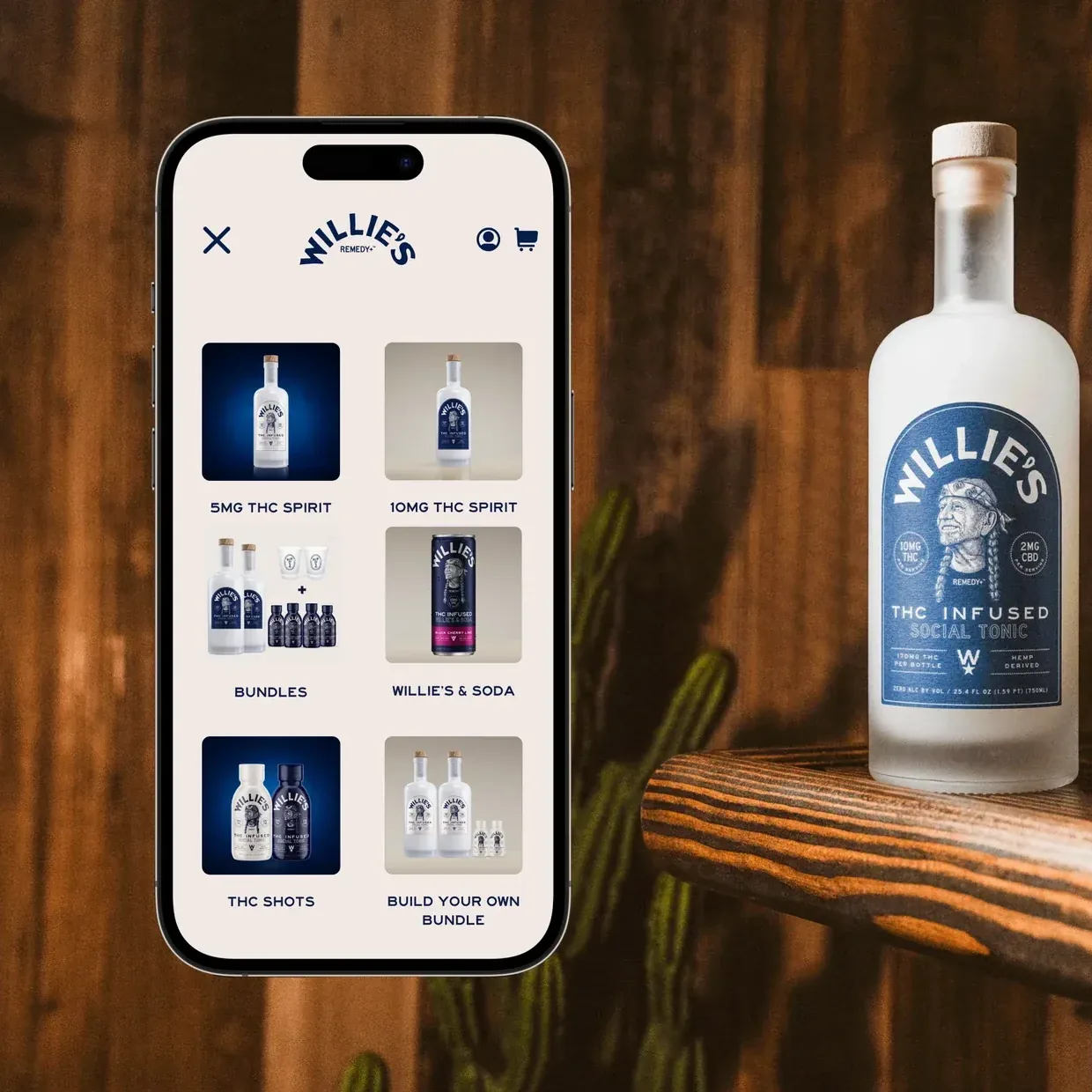 Willie’s Remedy+ mobile menu with product categories shown as image tiles, beside a frosted social tonic bottle on a wooden shelf