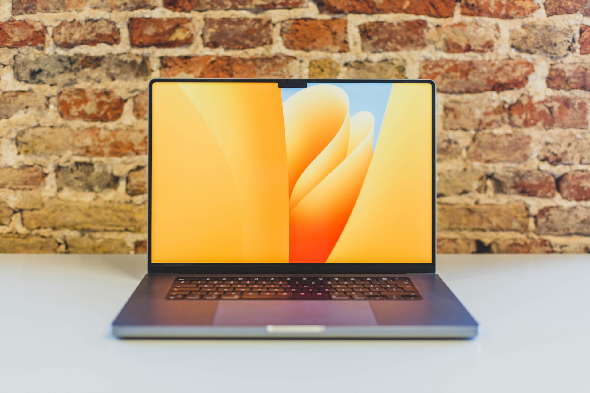 laptop on table - Best Computer for Music Production