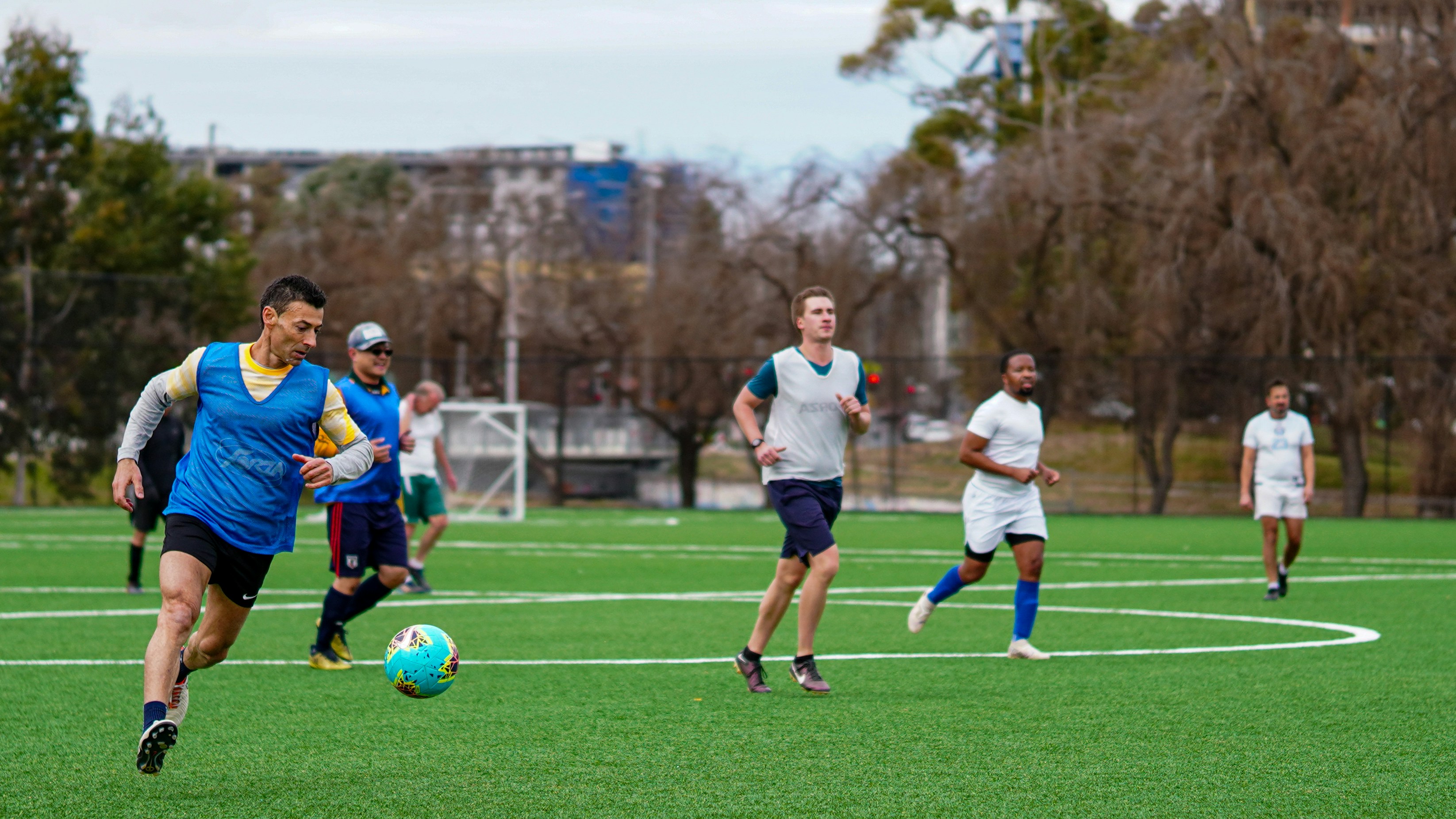 A group of men playing a game of soccer
