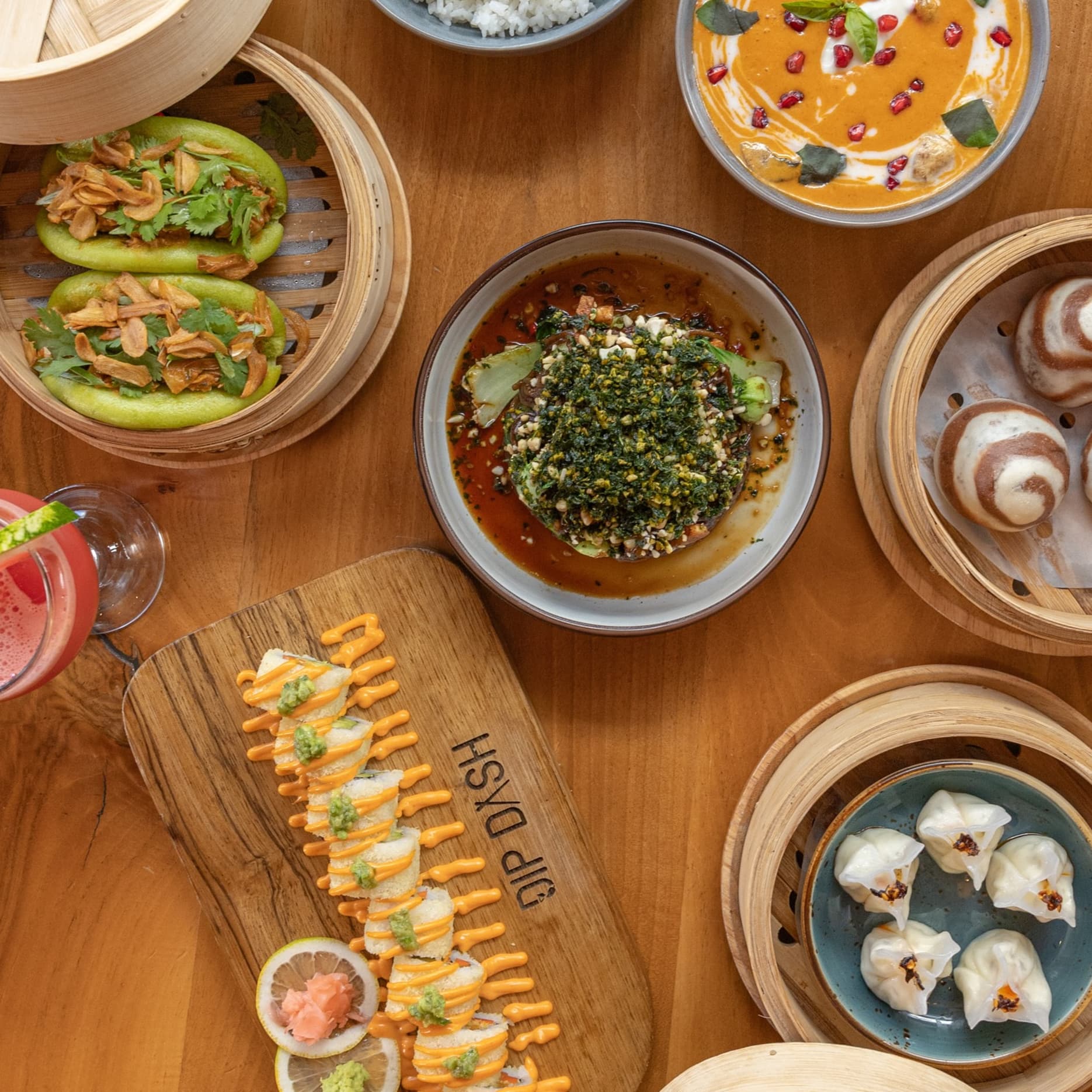 Vibrant vegan meals with a variety of lively and delicious dishes placed on a table, ready for sharing in a social dining setting.