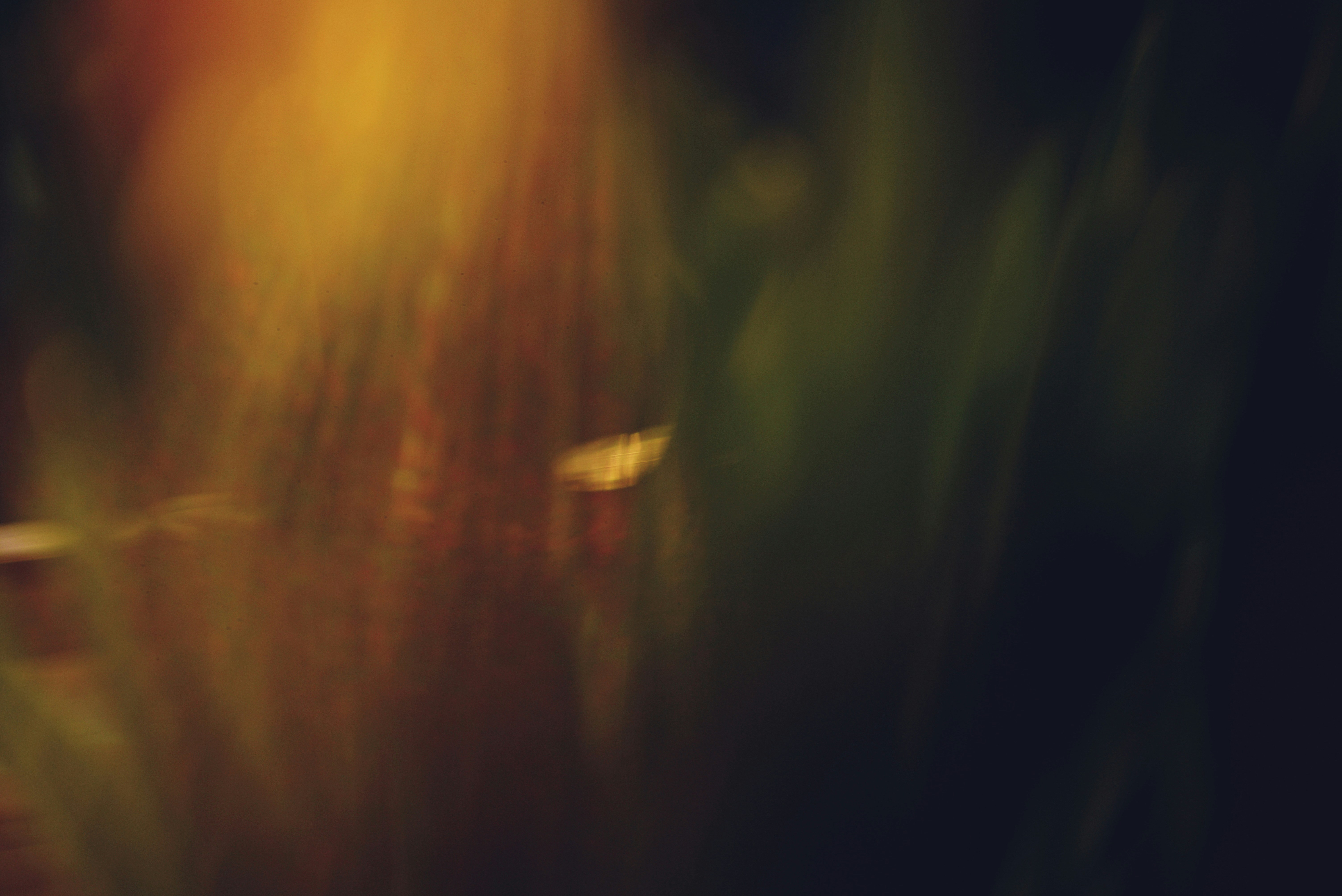 Abstract blend of colors in a dark background.