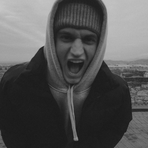 Black and white portrait of a man with a beard and glasses