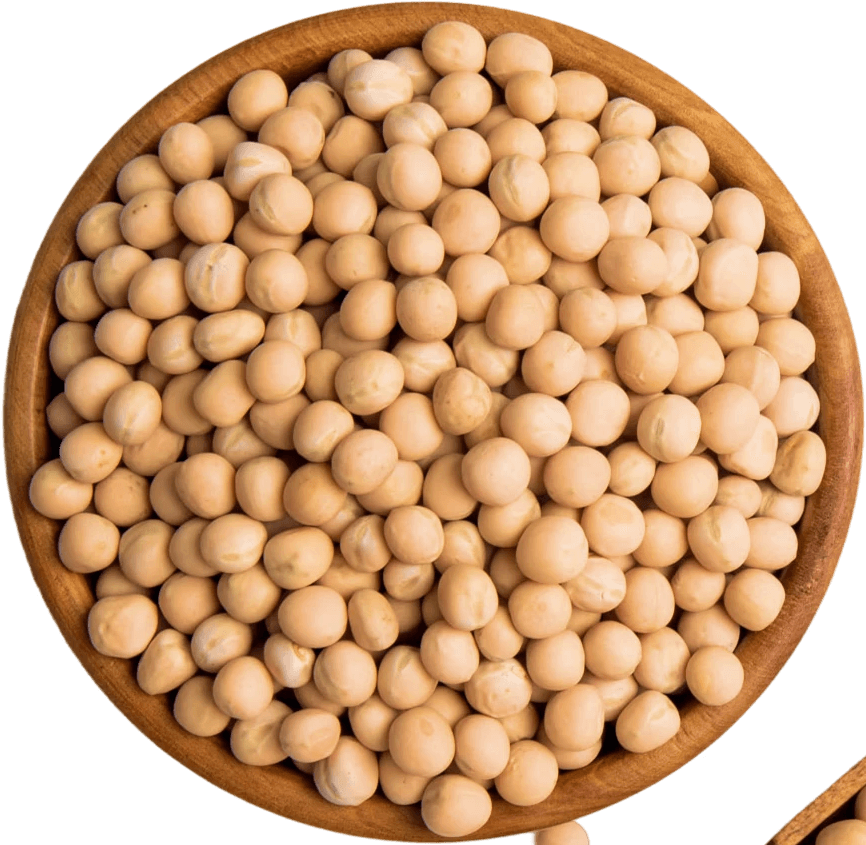 Top view of dried soybeans in a wooden bowl on a black background.