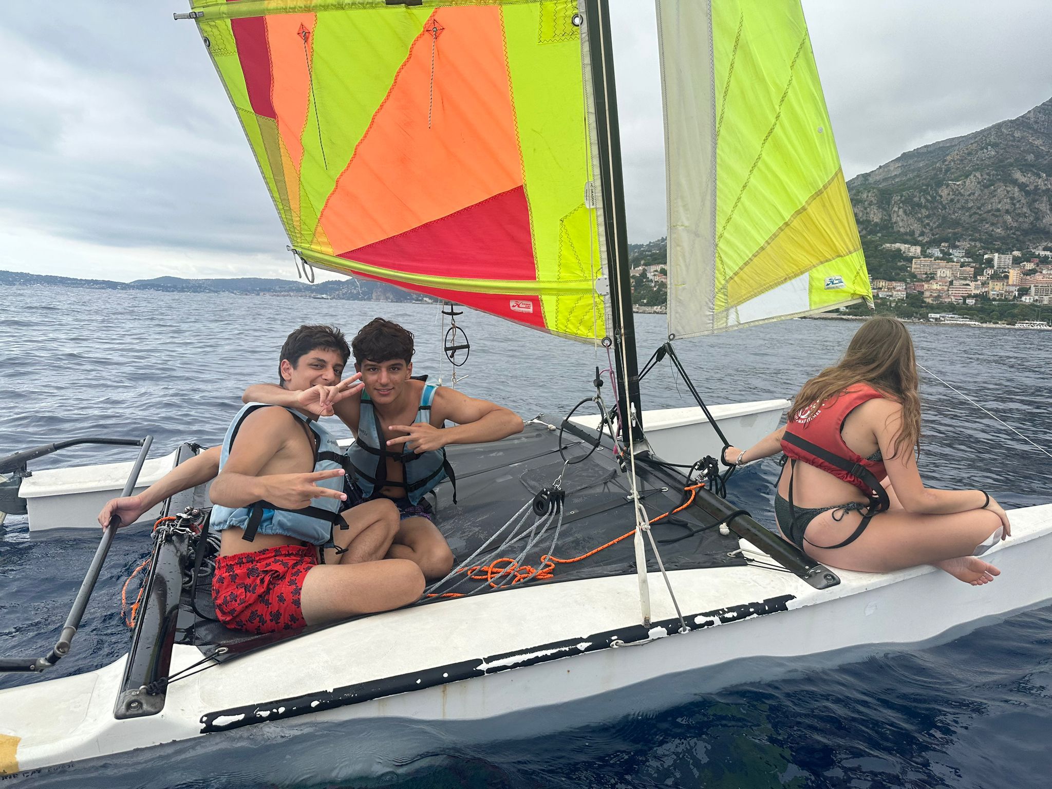 woman in black hijab and red white striped long sleeve shirt