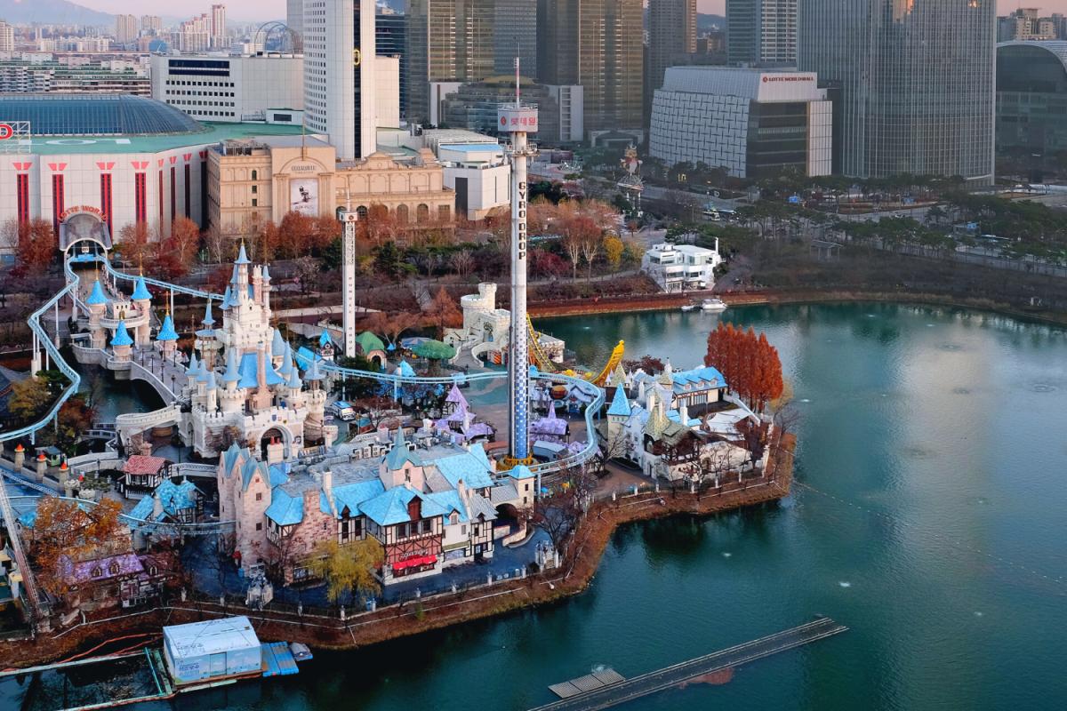 brown and white temple surrounded by green trees during daytime