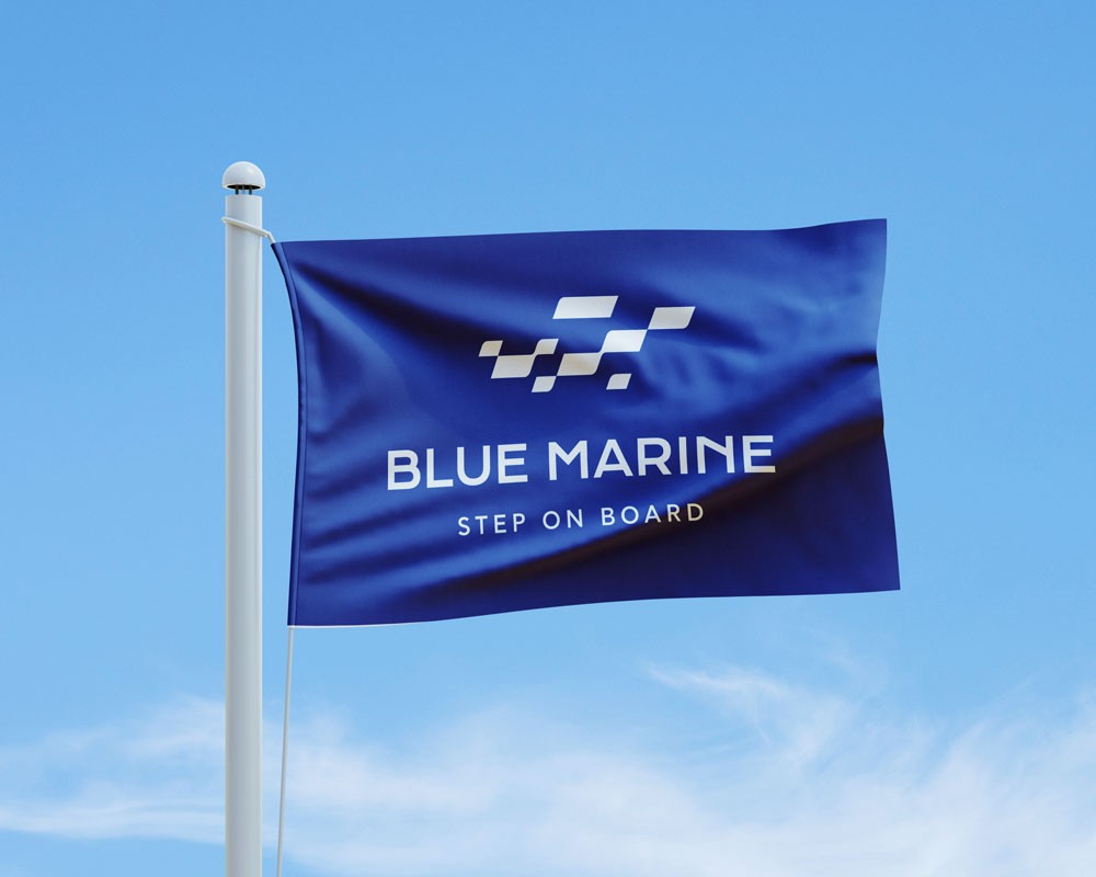 Application of the Blue Marine identity on a flag, enhancing brand visibility within its natural marine environment