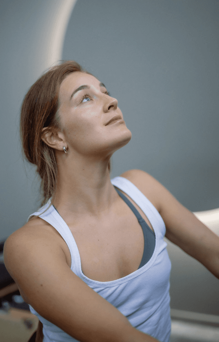 Black cosmetic product bottle against a dark background
