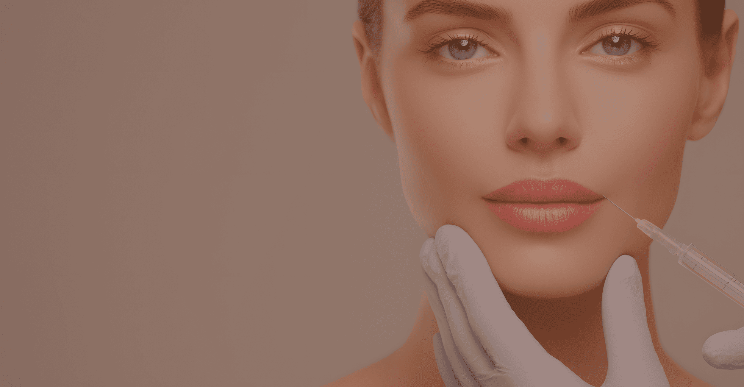 A woman receiving lip filler injections