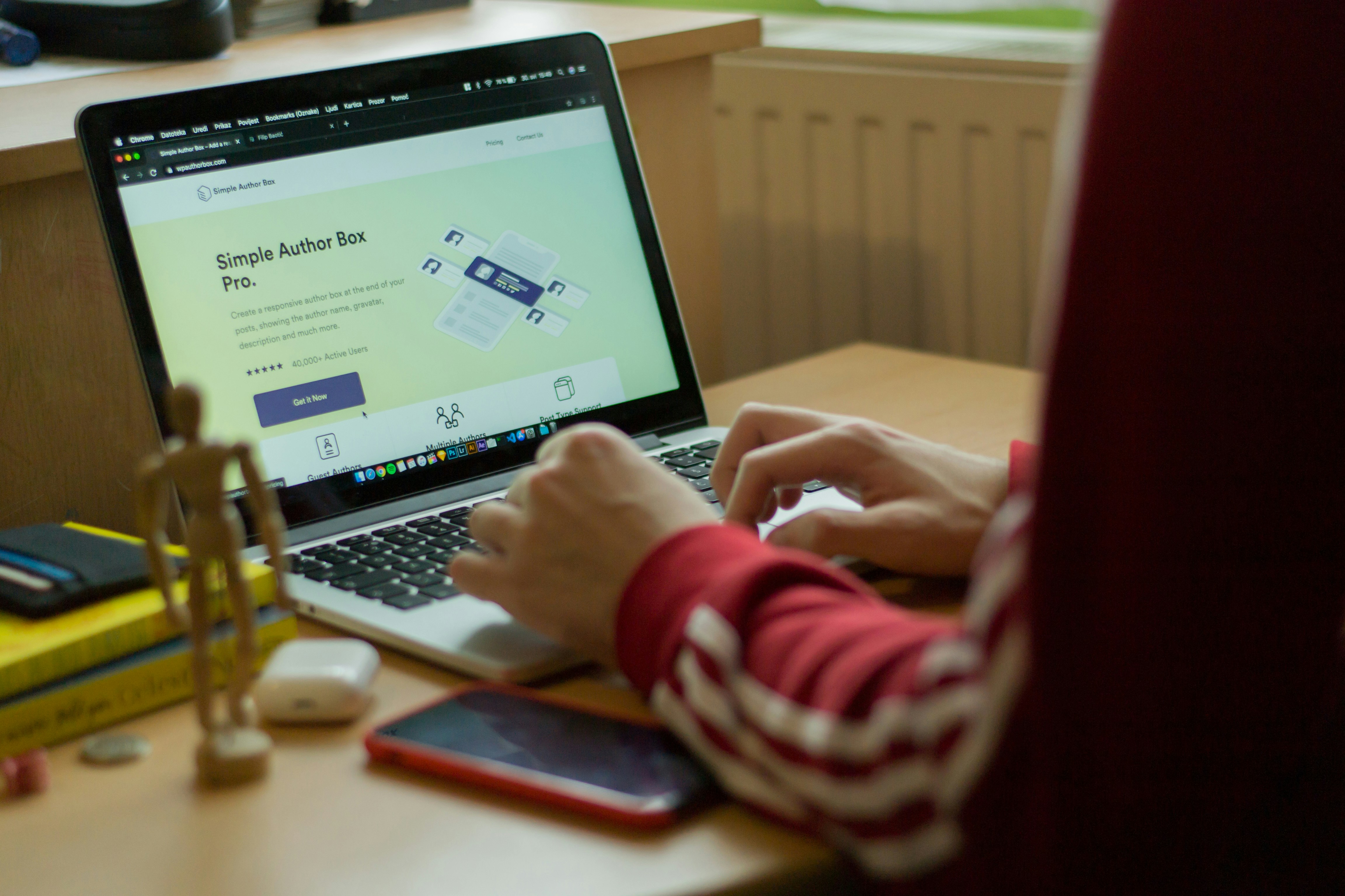 person typing on a laptop keyboard