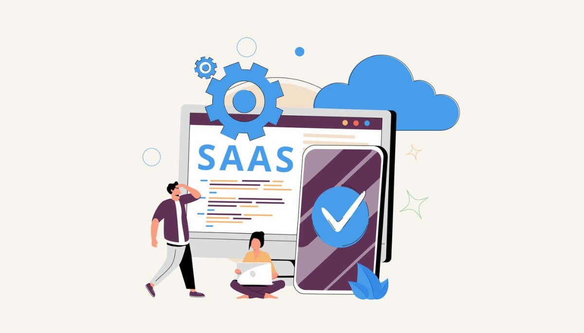 Illustration of a computer monitor displaying “SAAS” surrounded by cloud icons, gears, and mobile devices, representing the concept of Software as a Service and its cloud-based subscription business model.