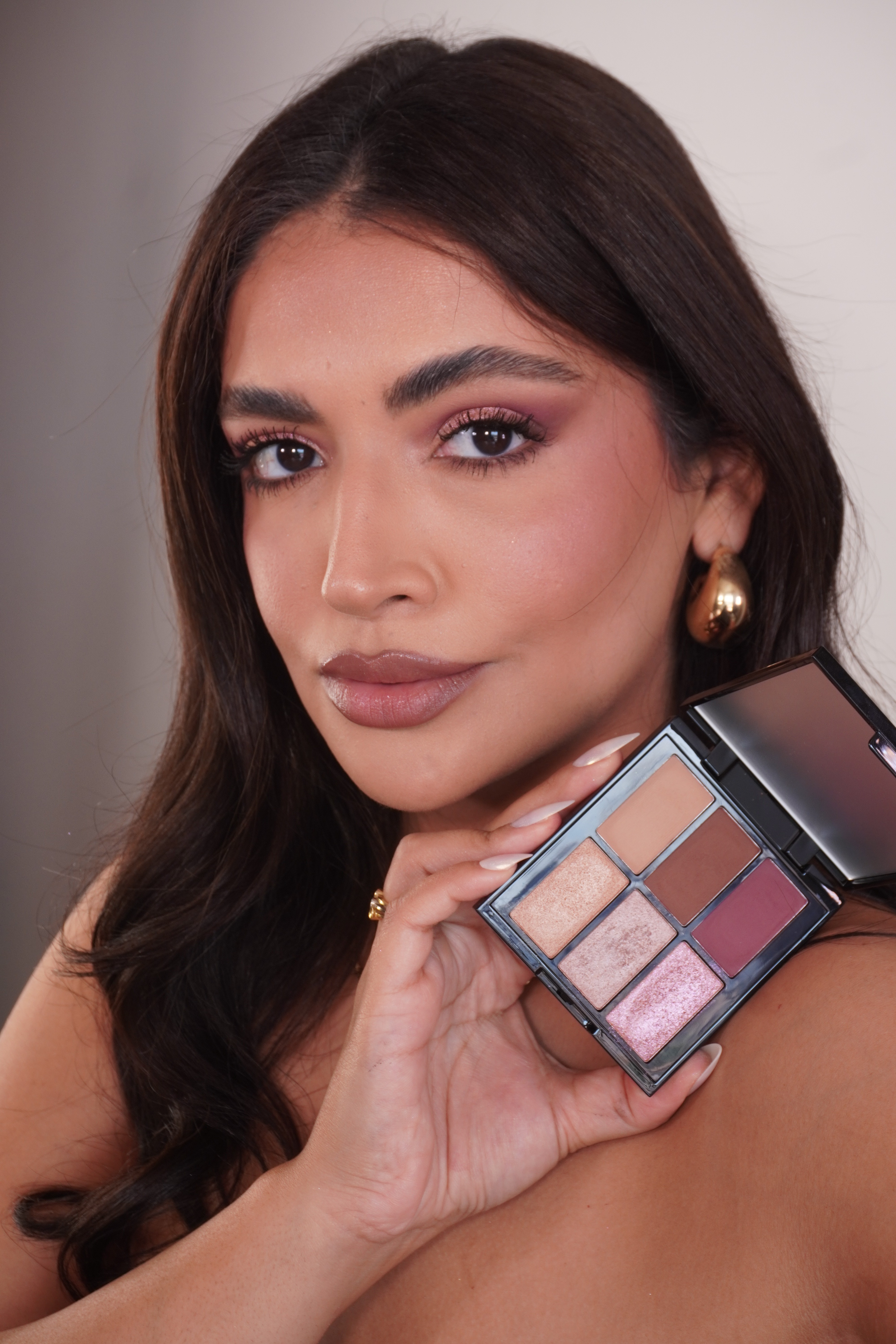 Beautiful lady with a ray of sunlight shining on her face