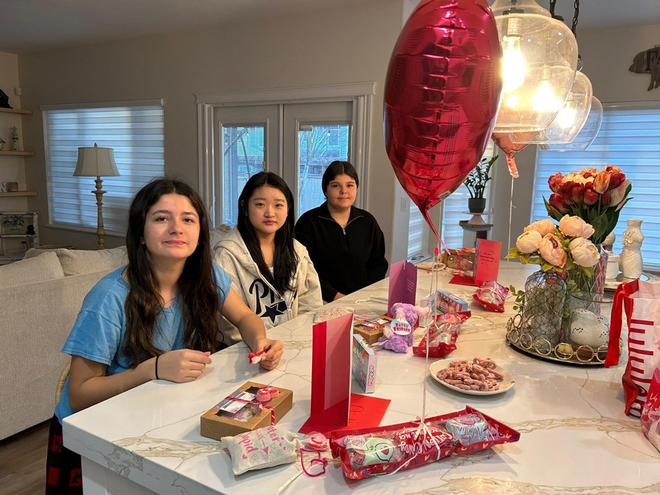 skyline photography of boat passing on waters overlooking buildings