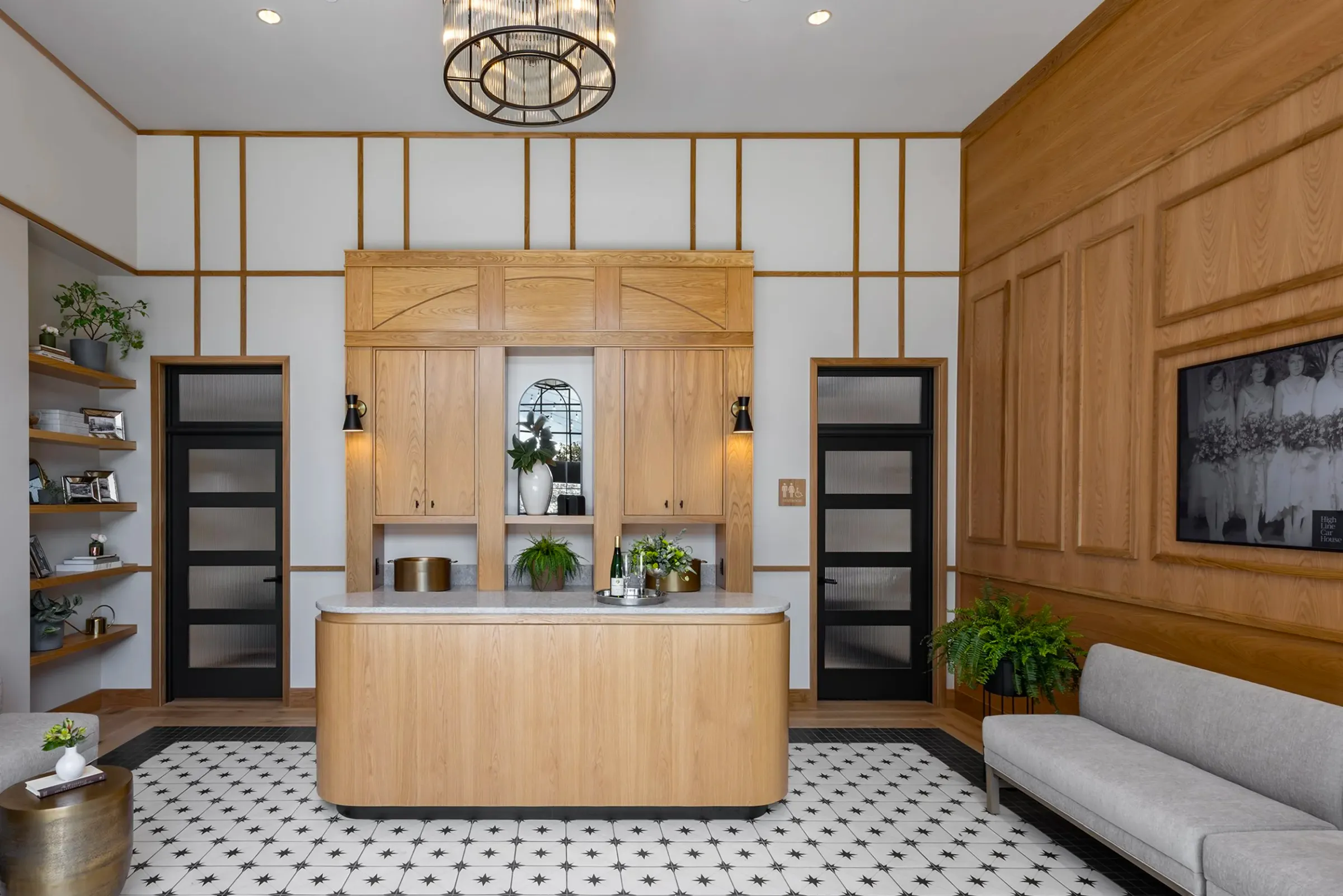 Foyer with wood welcome bar and tile floor