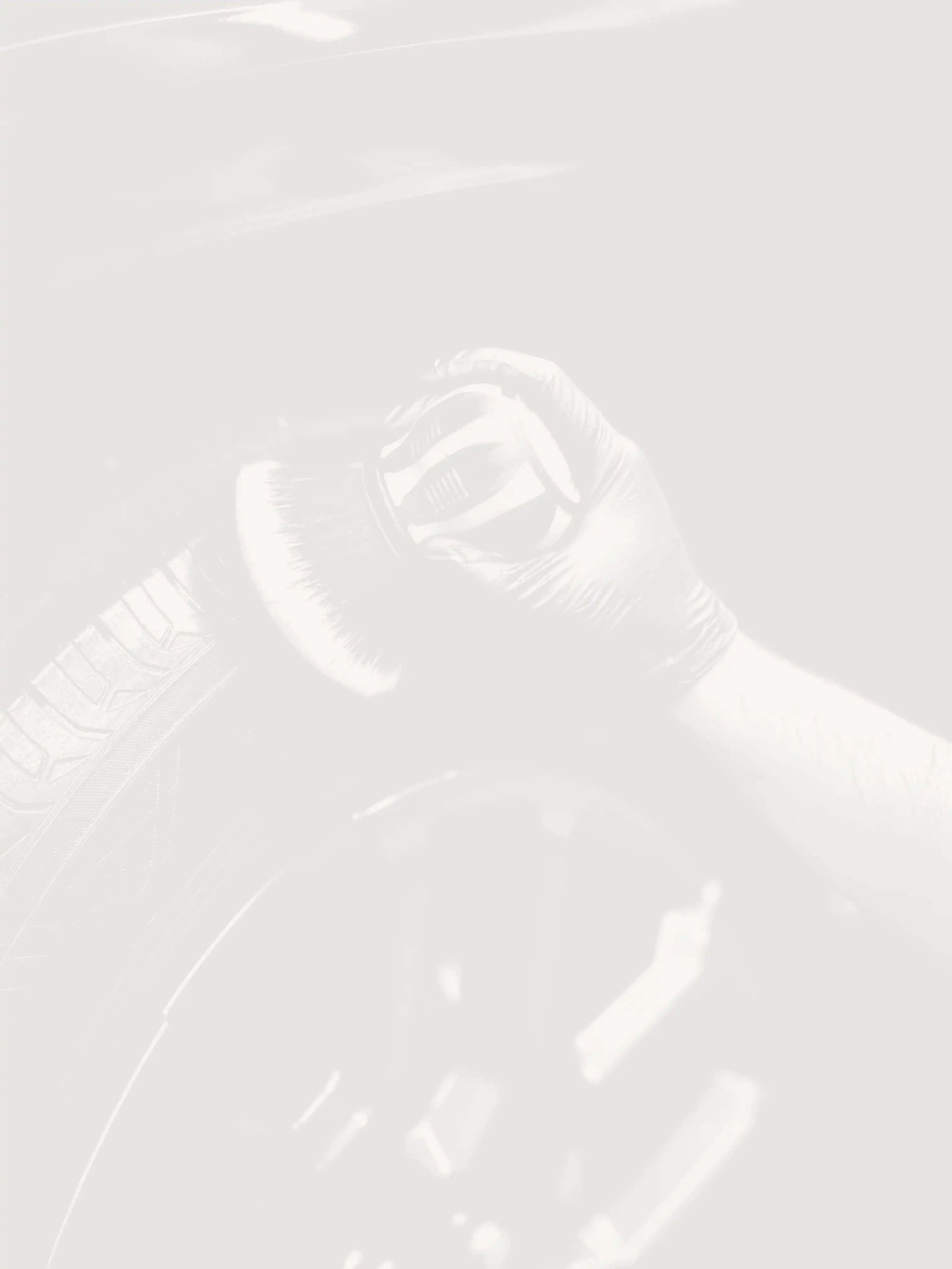 a man with a glove on his hand is changing the tire of a car