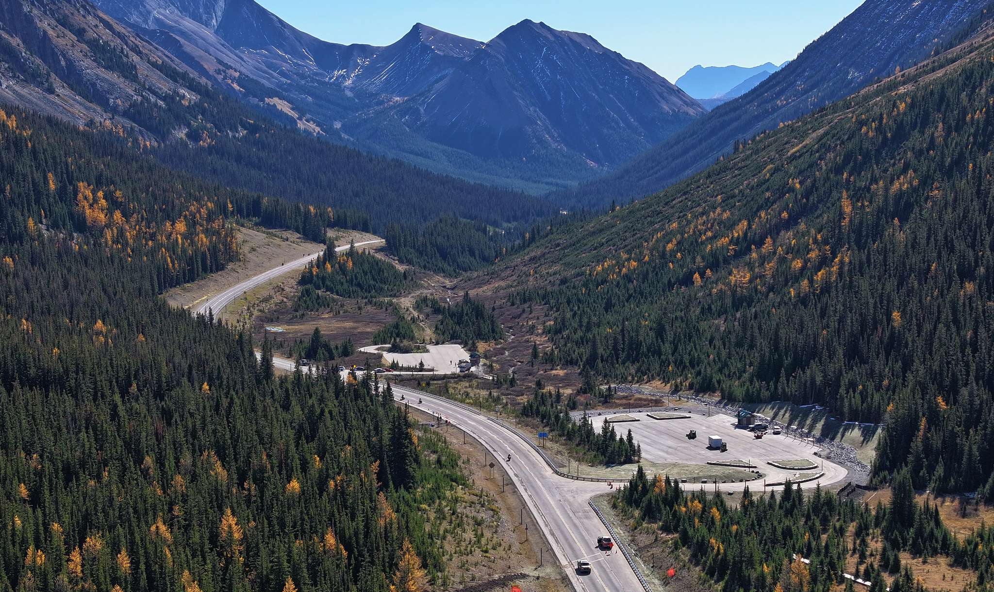 Aerial view of expanded Highwood Meadows parking area in high-altitude mountain pass along Highway 40