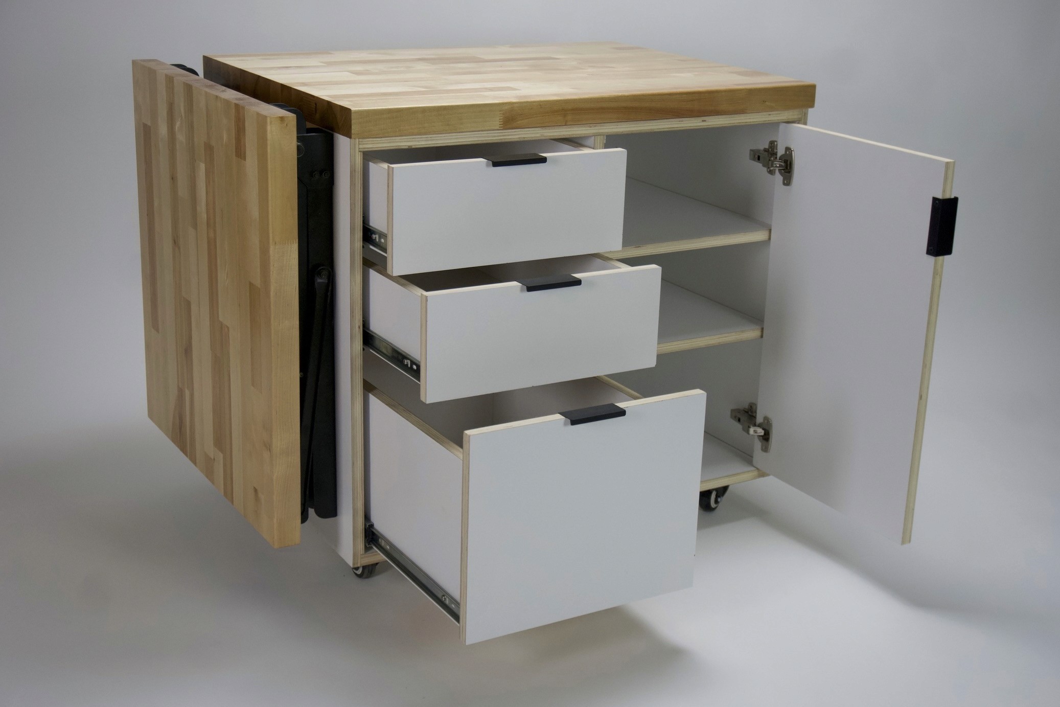 Mobile wood-topped cabinet with open drawers and a side extension