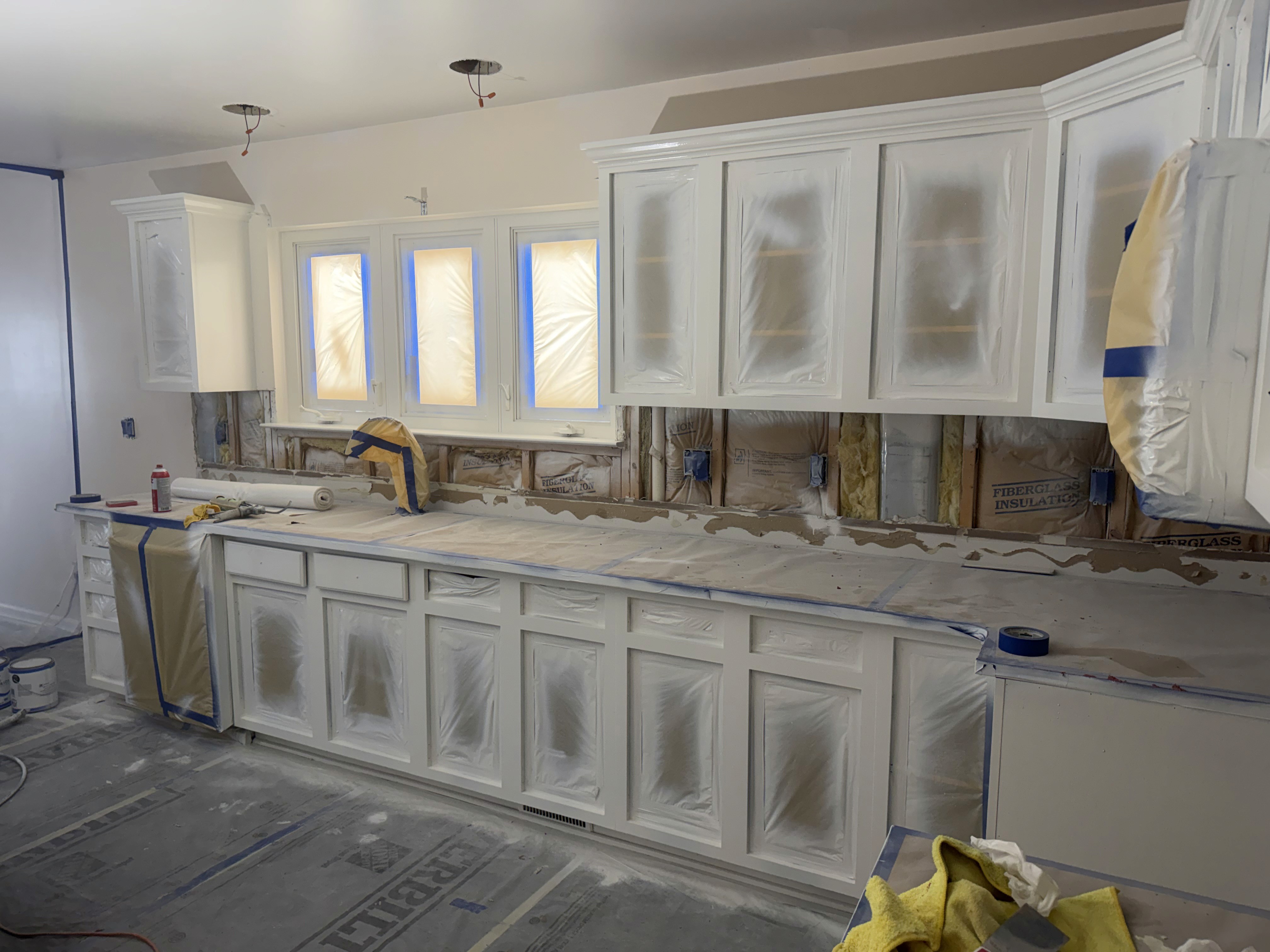 Large cabinet wall masked and prepared in place