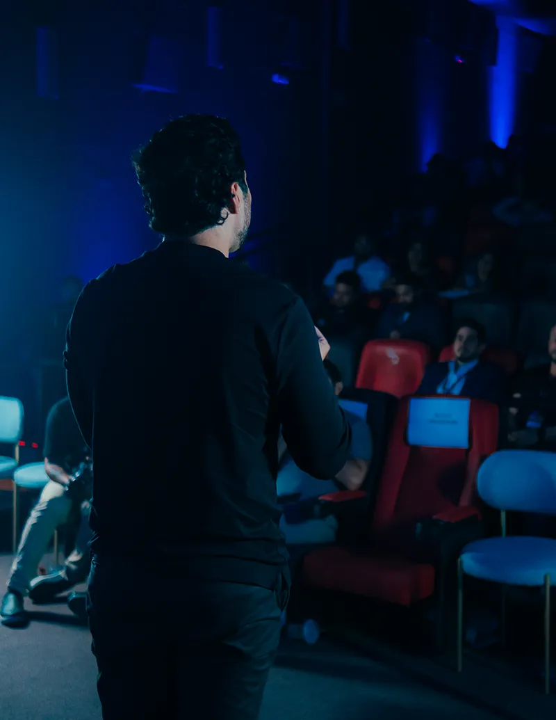 Speaker Presenting at Conference with Audience