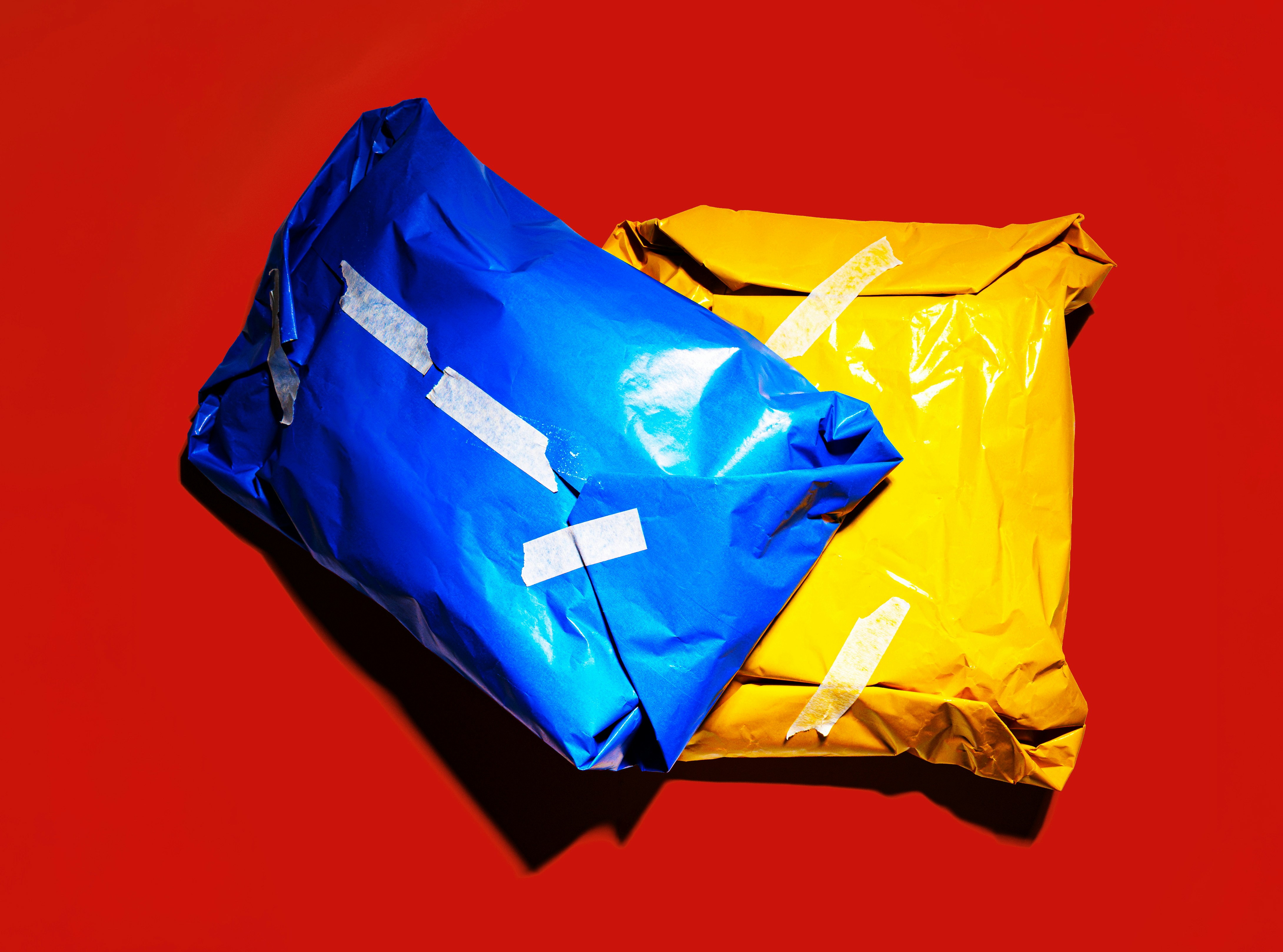a yellow and a blue package lie on a table