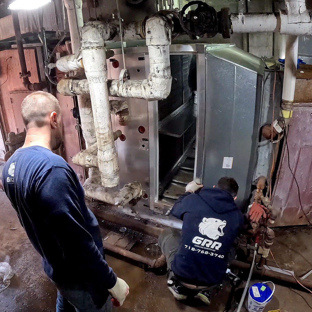 GRR Cooling Experts technician completing coil section retrofit work inside The Brooklyn Hospital Center.