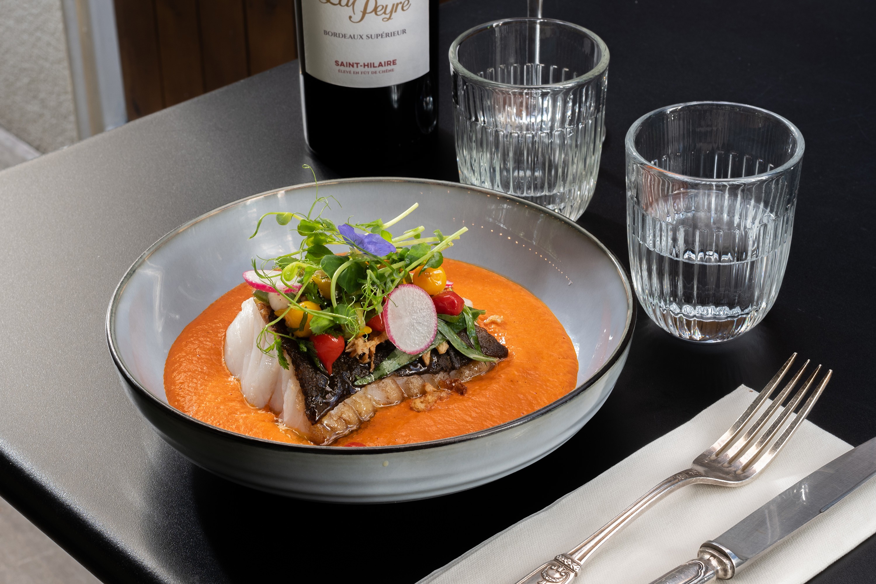 a vanilla ice cream with matcha cream served in a white plate