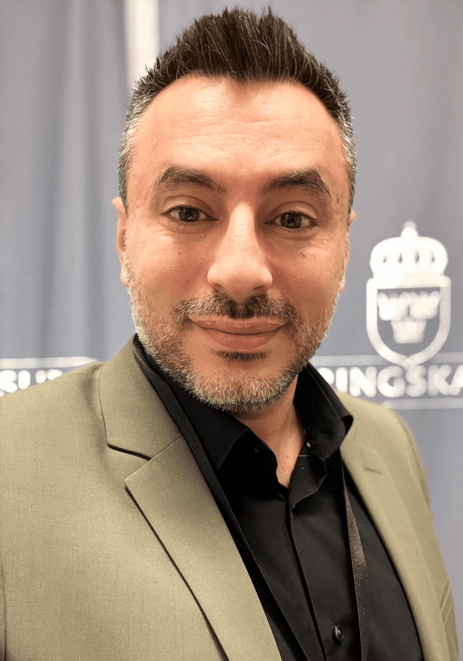 man standing beside wall