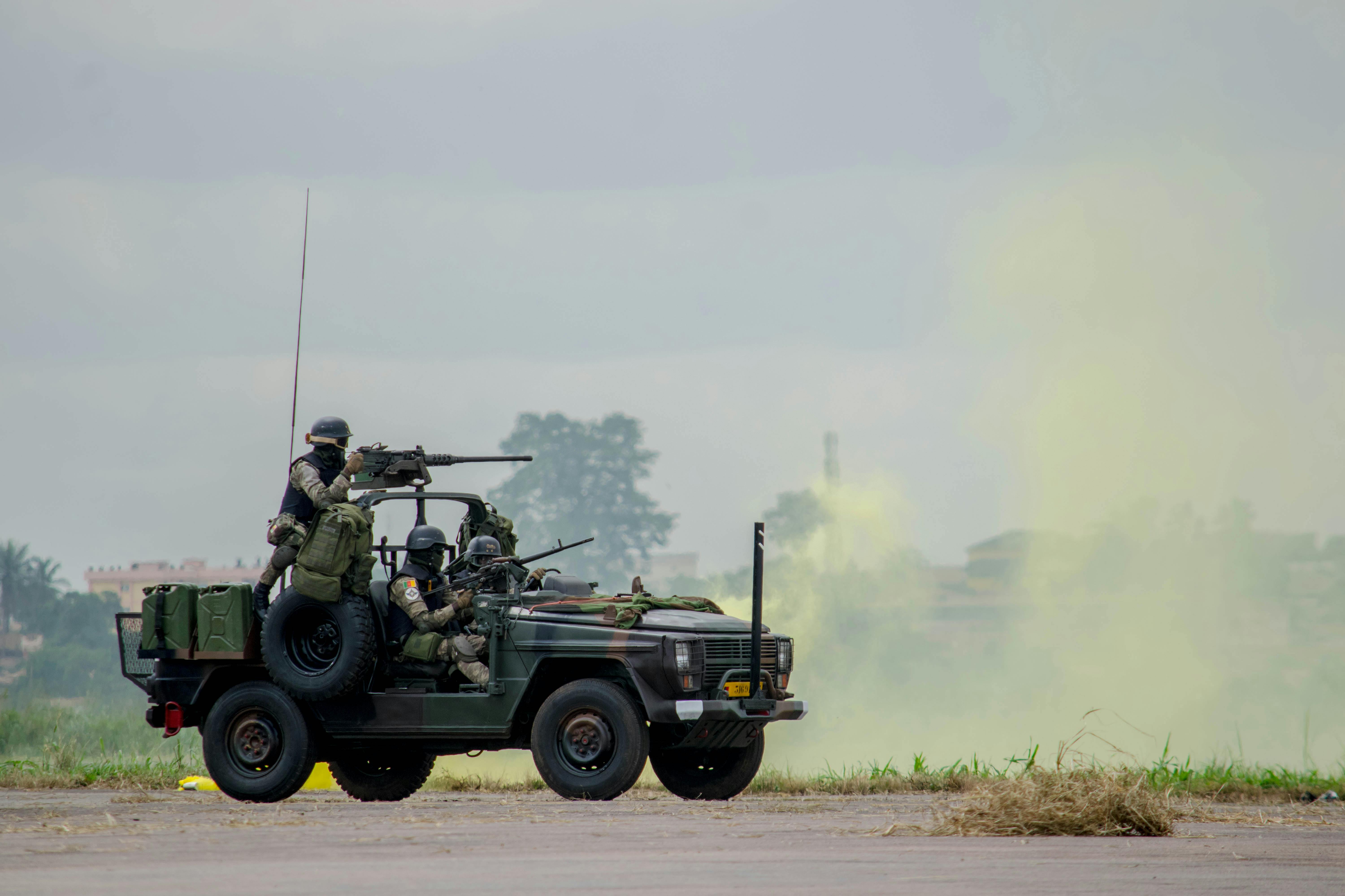 AD Missile Crew during a non-combat training operation, positioned in a tactical vehicle with visible weaponry and communication gear.