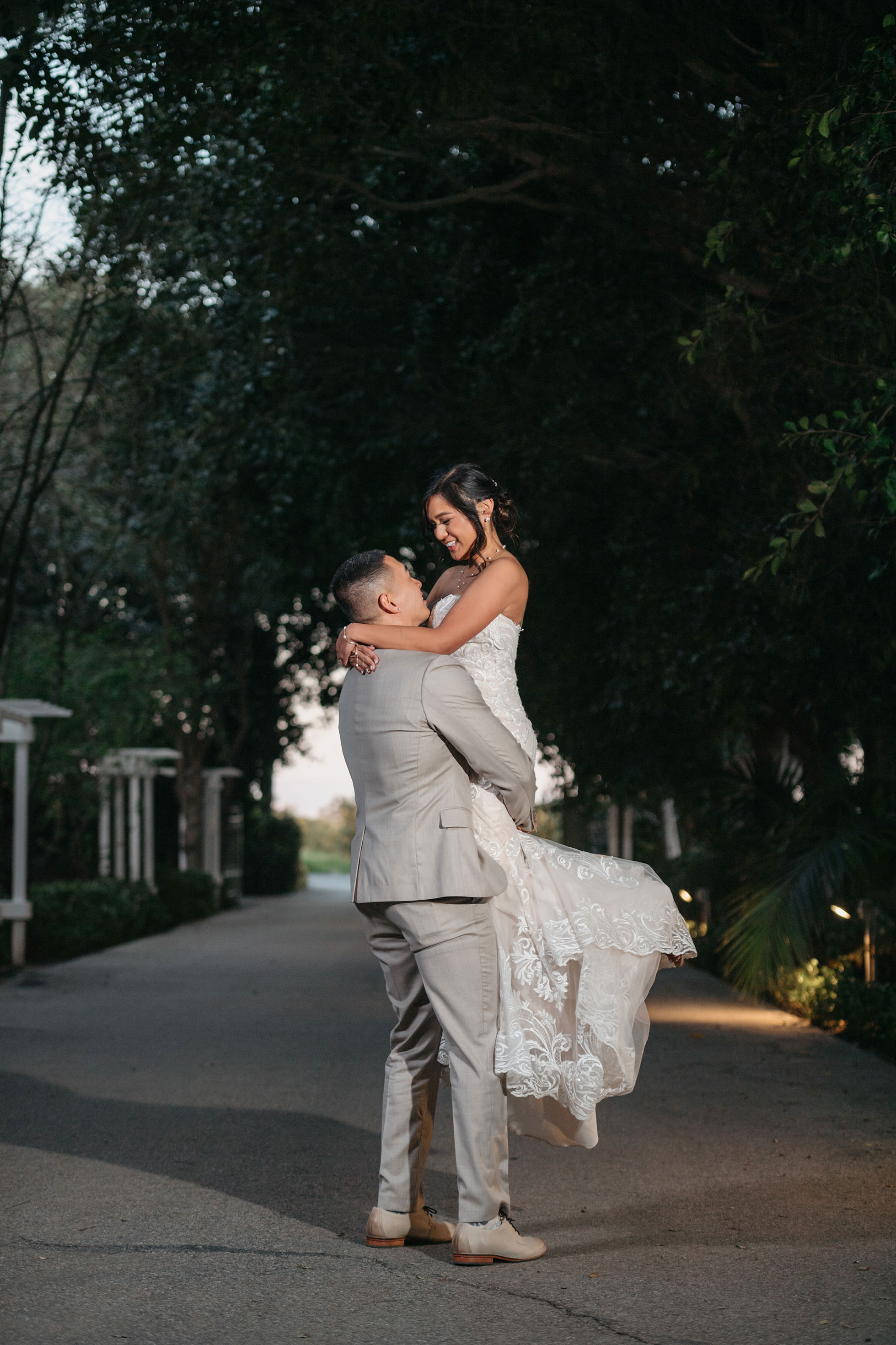 Flat lay wedding details with bouquet, rings, and sparkling bridal heels