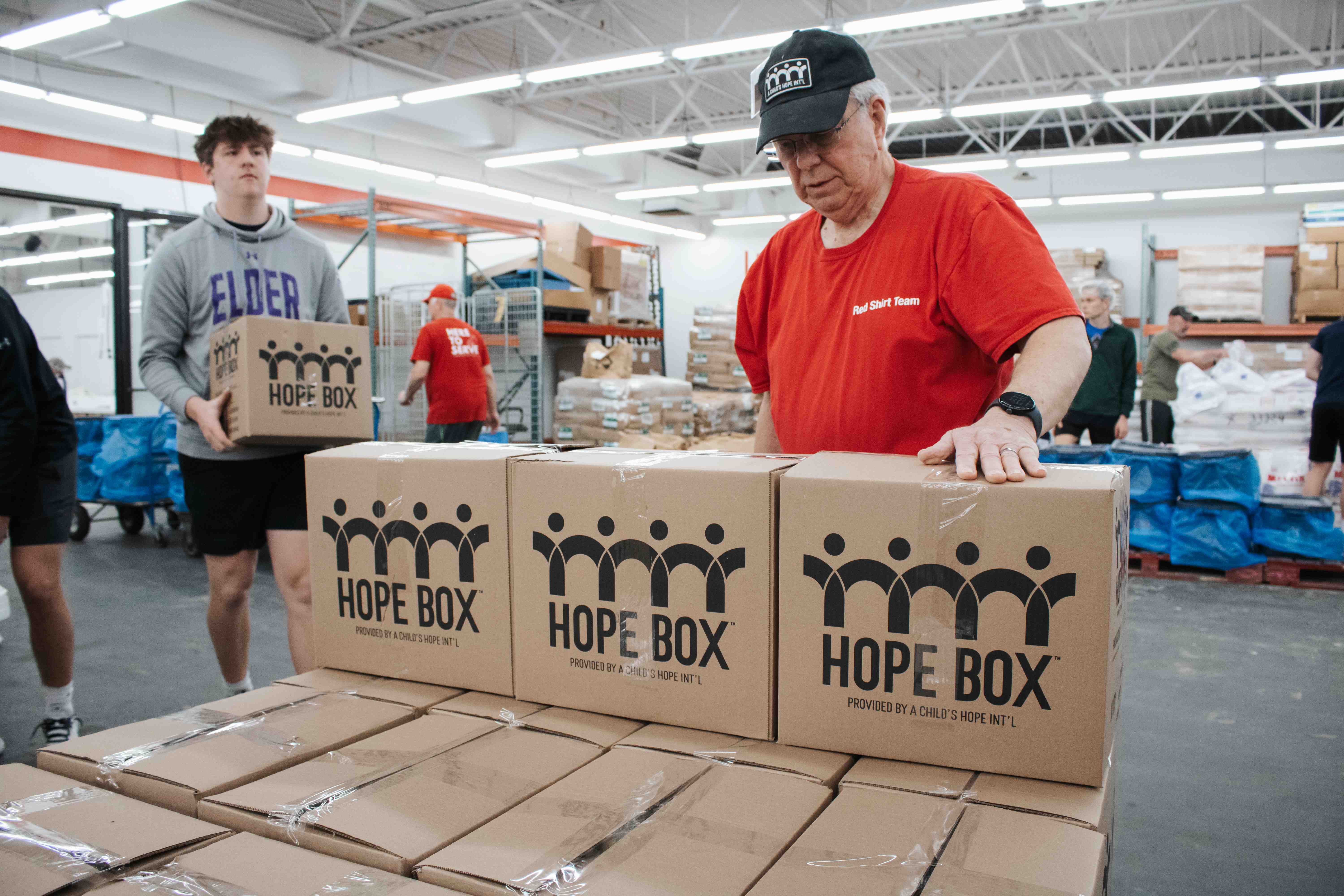 Volunteers pack Hope Boxes at A Child’s Hope Int’l to support children and families in need.