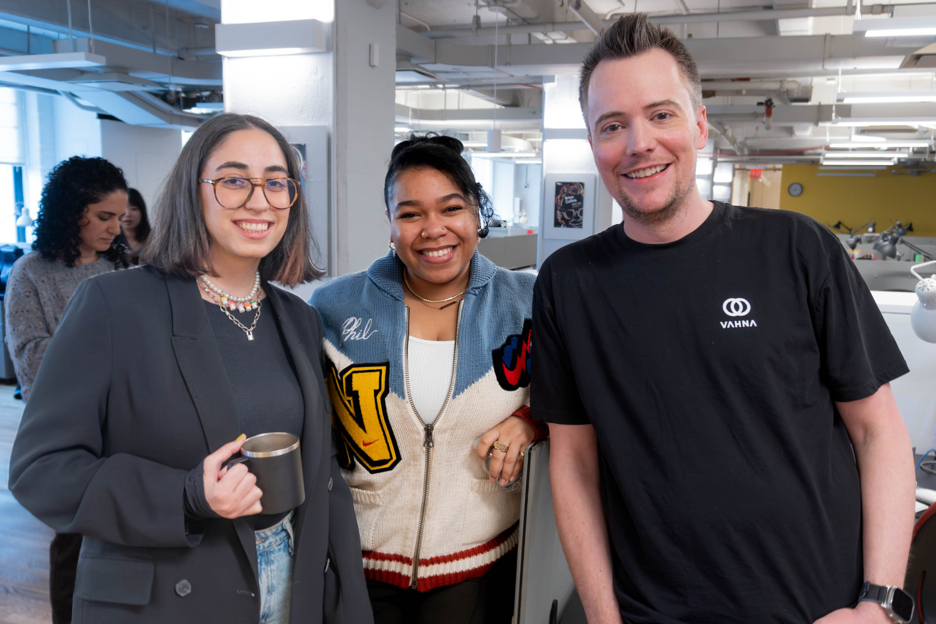 three people posing for a photo