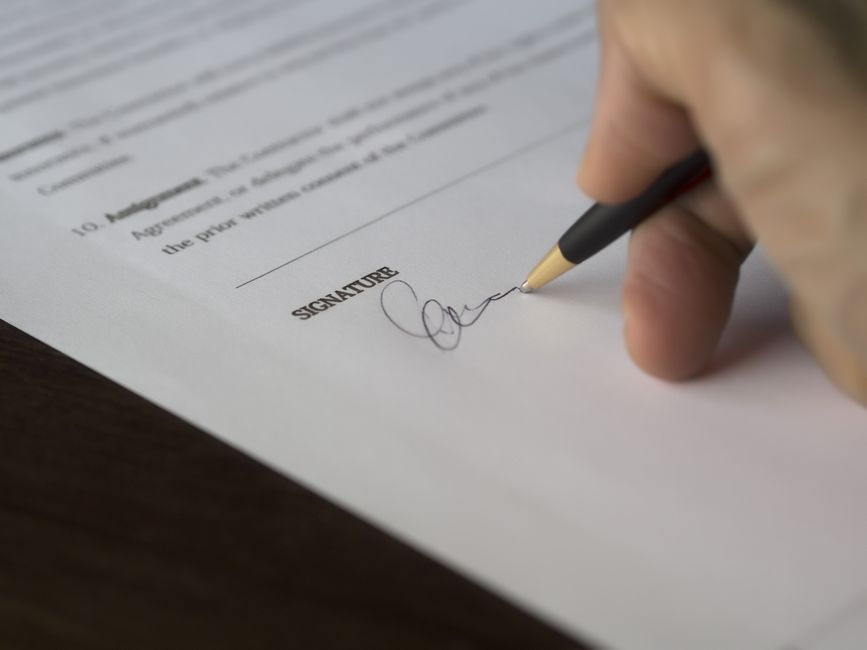 signed contract on a desk
