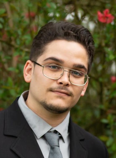 A portrait of a young man smiling