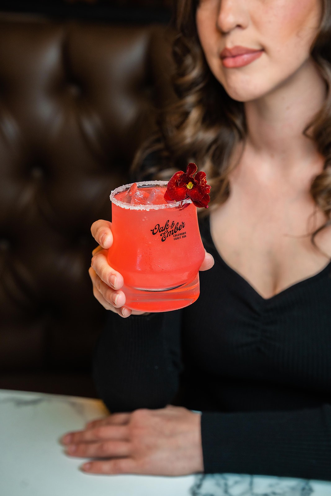 Oak and Ember red cocktail with garnish