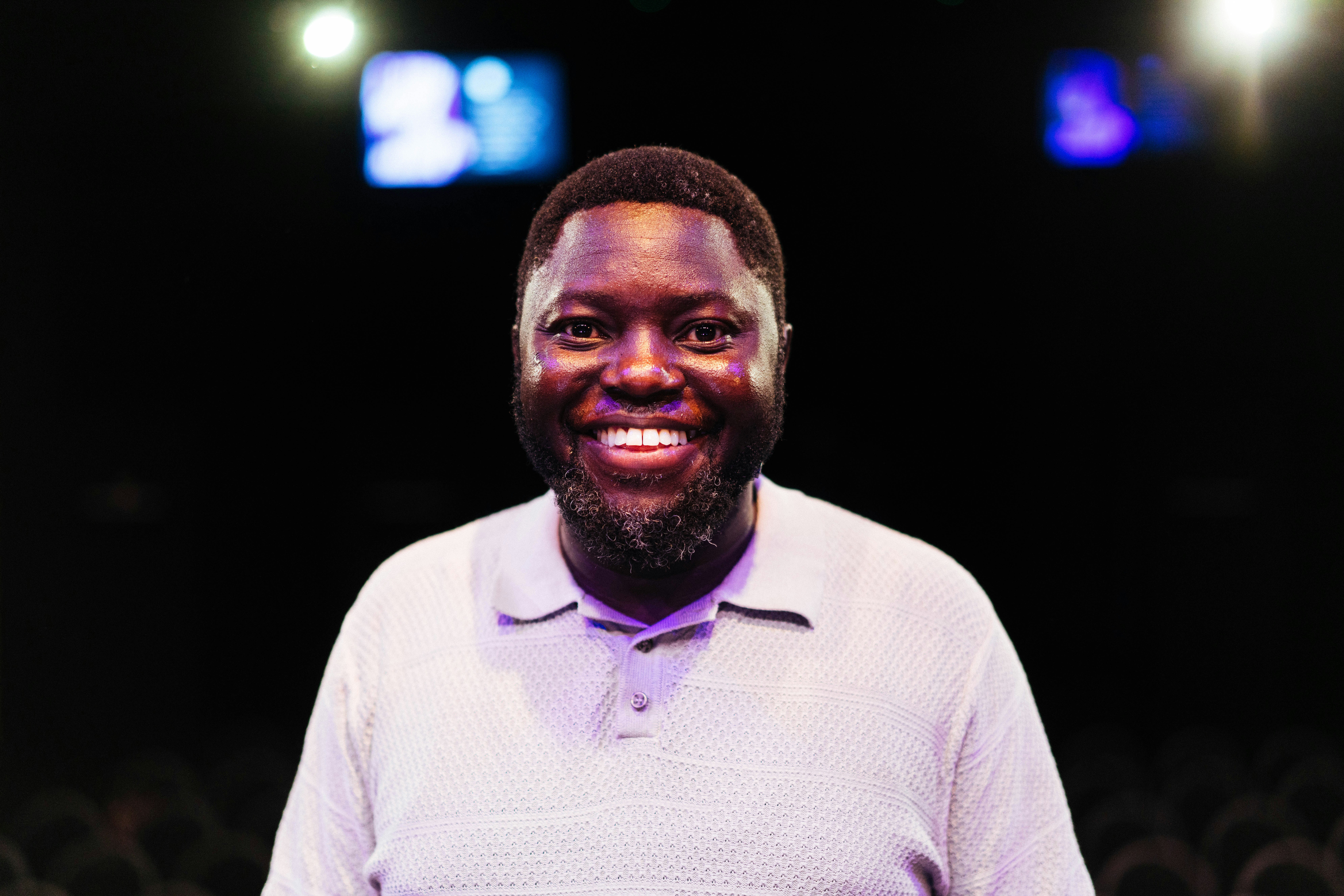 A smiling man poses for the camera.