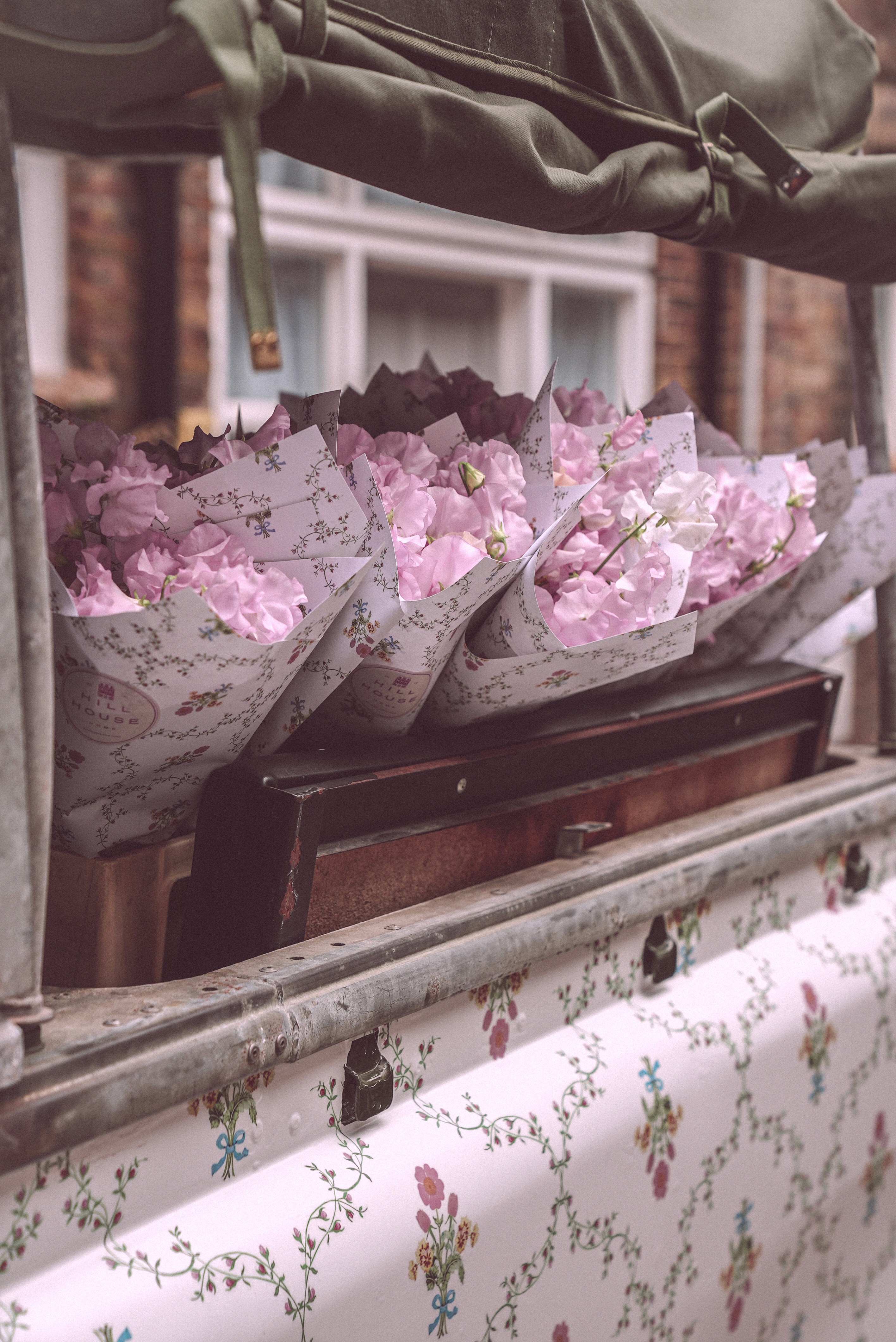 Bride in white dress walking on street, blurred motorcycle passing