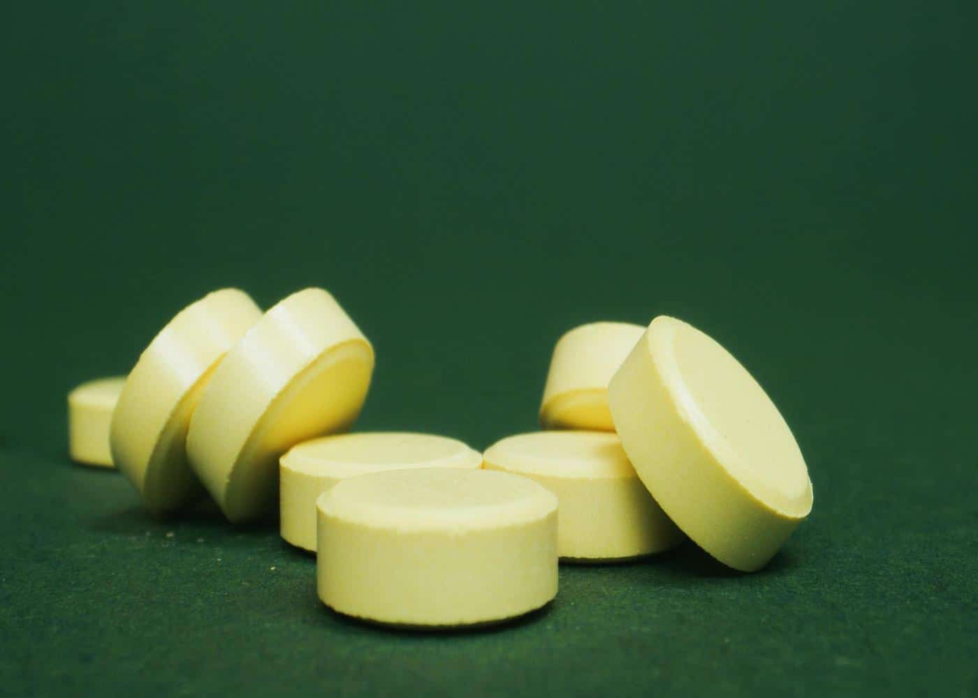 Huberman Supplements - Picture of supplement pills against a green background