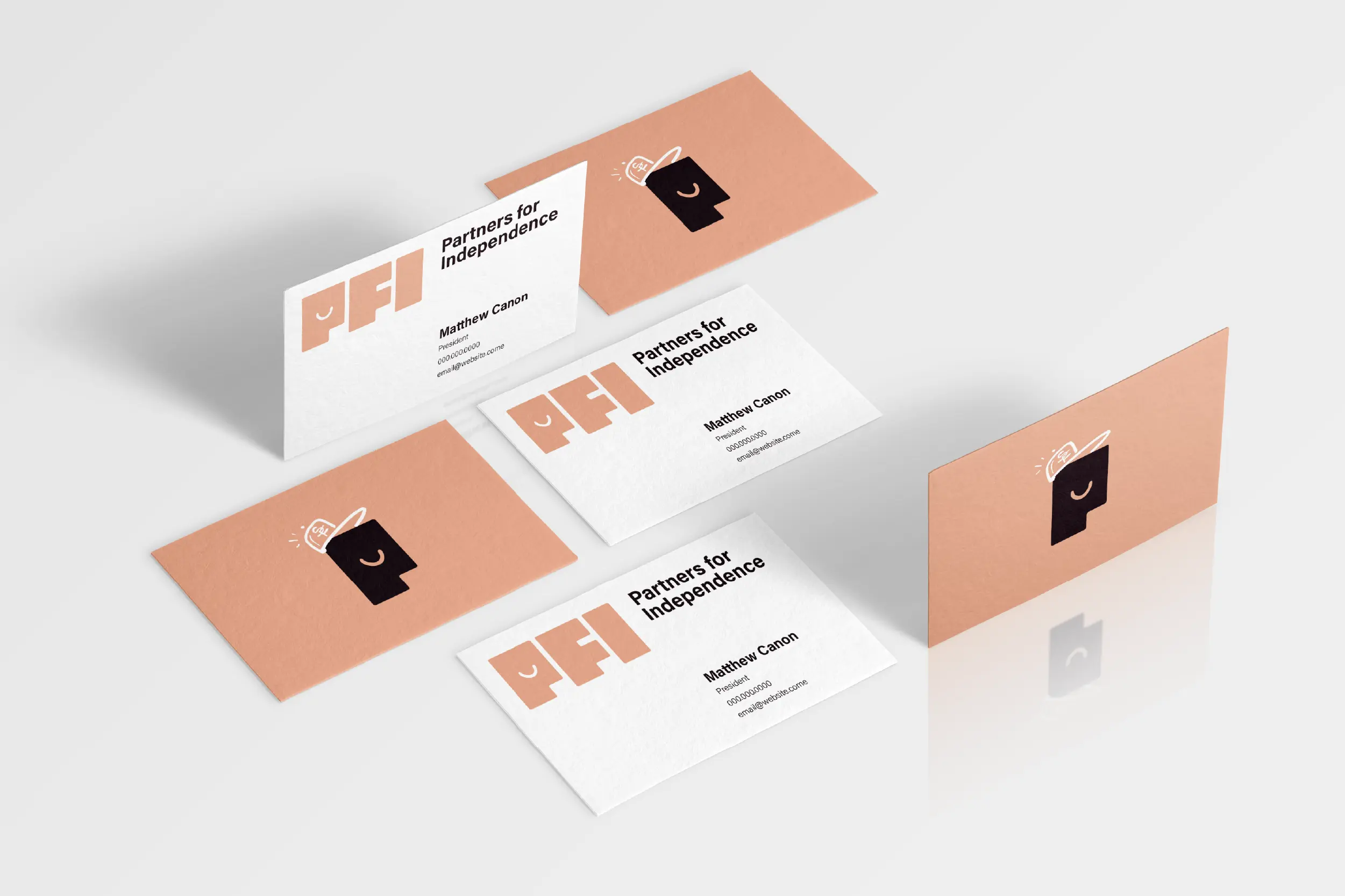 Partners for Independence business card mockups showcasing brand colors and typography.