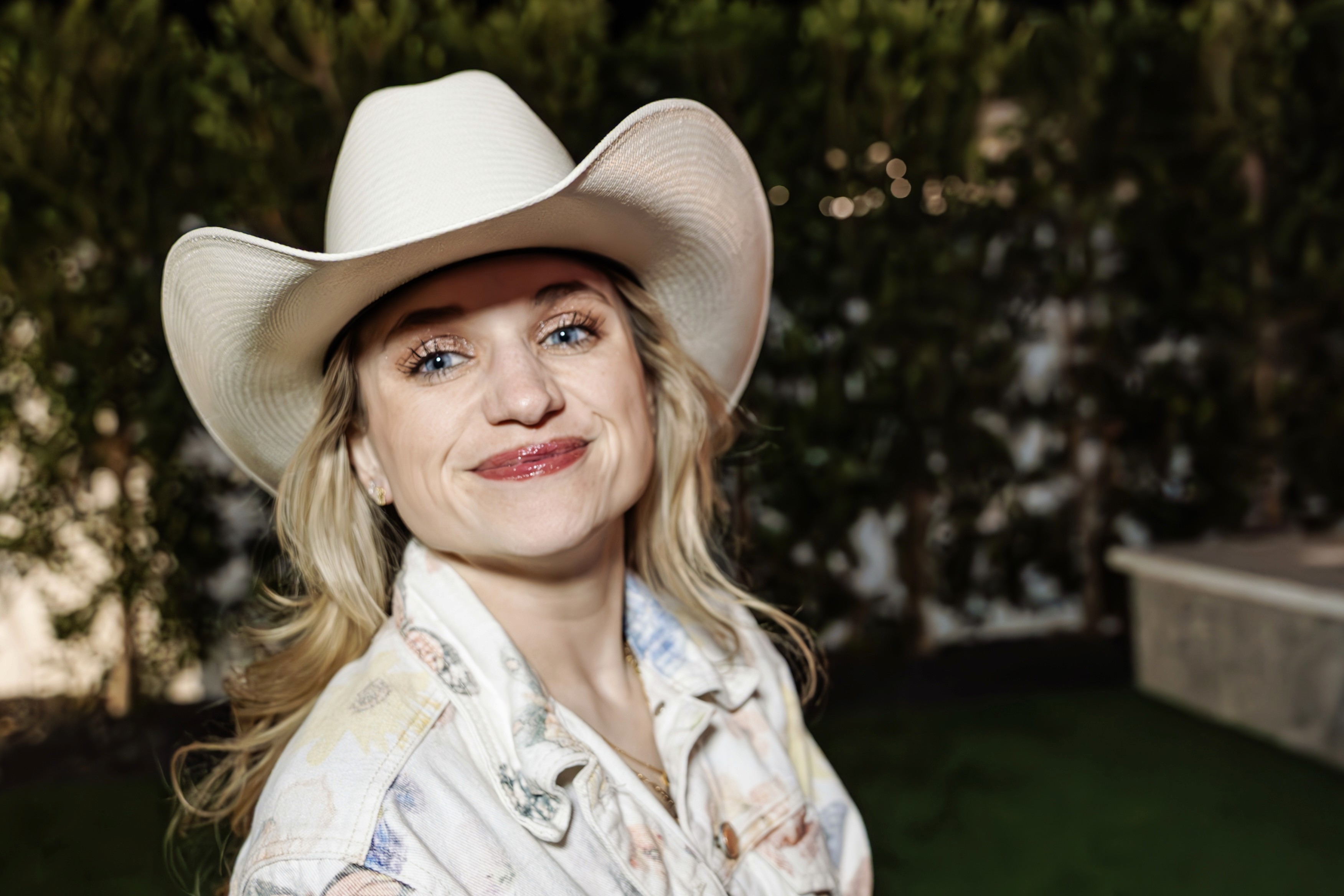 Beautiful blonde woman in a cowboy hat celebrating at a bachelorette party — fun, candid bachelorette photography by Lizz Spano Photography, destination photographer.