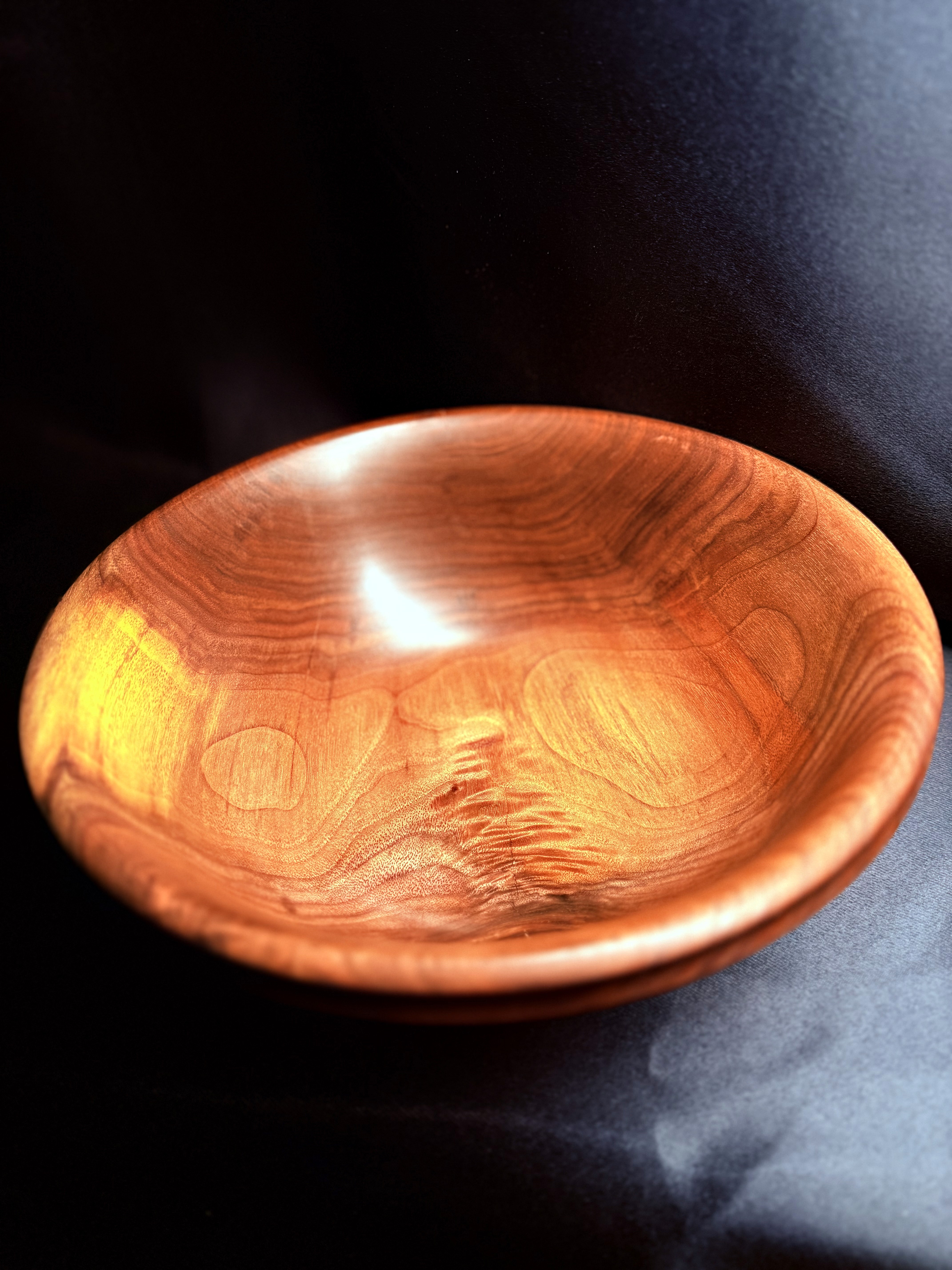 Alternate view of the hand-turned black walnut Golden Ripple Bowl.