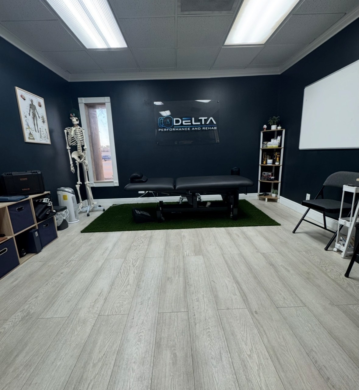 High-end gym weight training area with dumbbells, adjustable benches, and motivational wall art of a weightlifter, designed for strength and hypertrophy workouts.