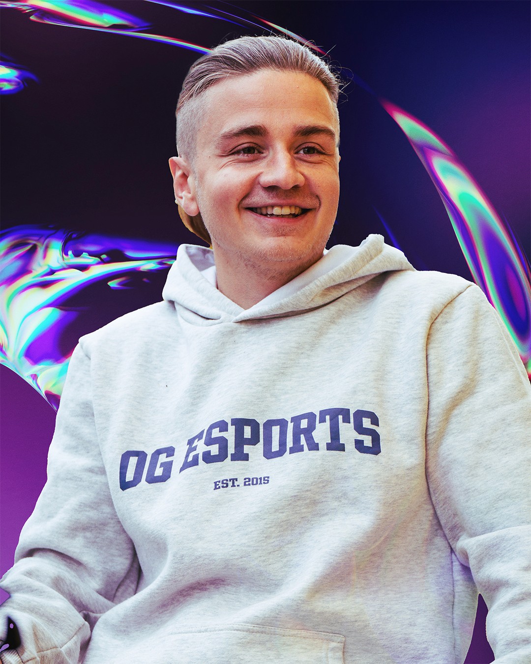 Portrait of a woman with long, smooth hair swept to the side, in a dark t-shirt, on a plain background.