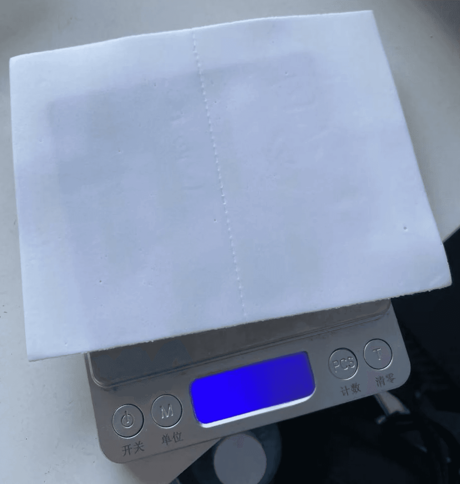 Scales showing the weight of the sheet