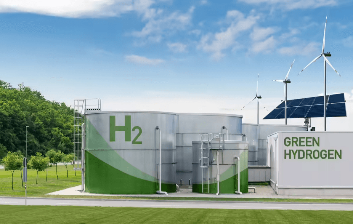 a farm field with a wind turbine in the background