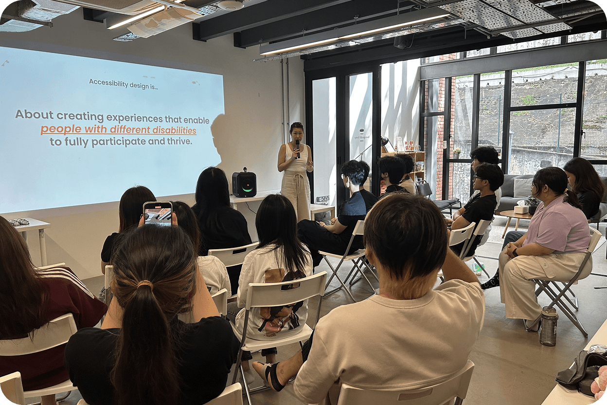 Students viewing a projection of PowerPoint slides and listening to Wendy's talk