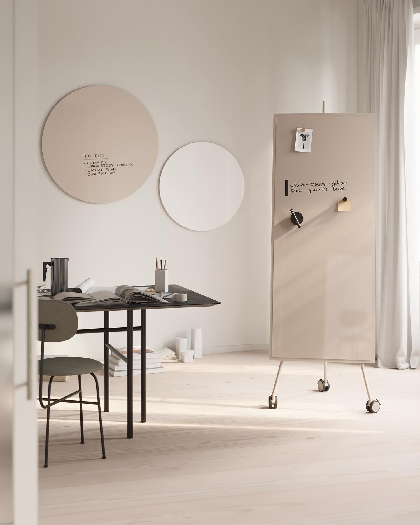 A table, a chair, and some different chat boards